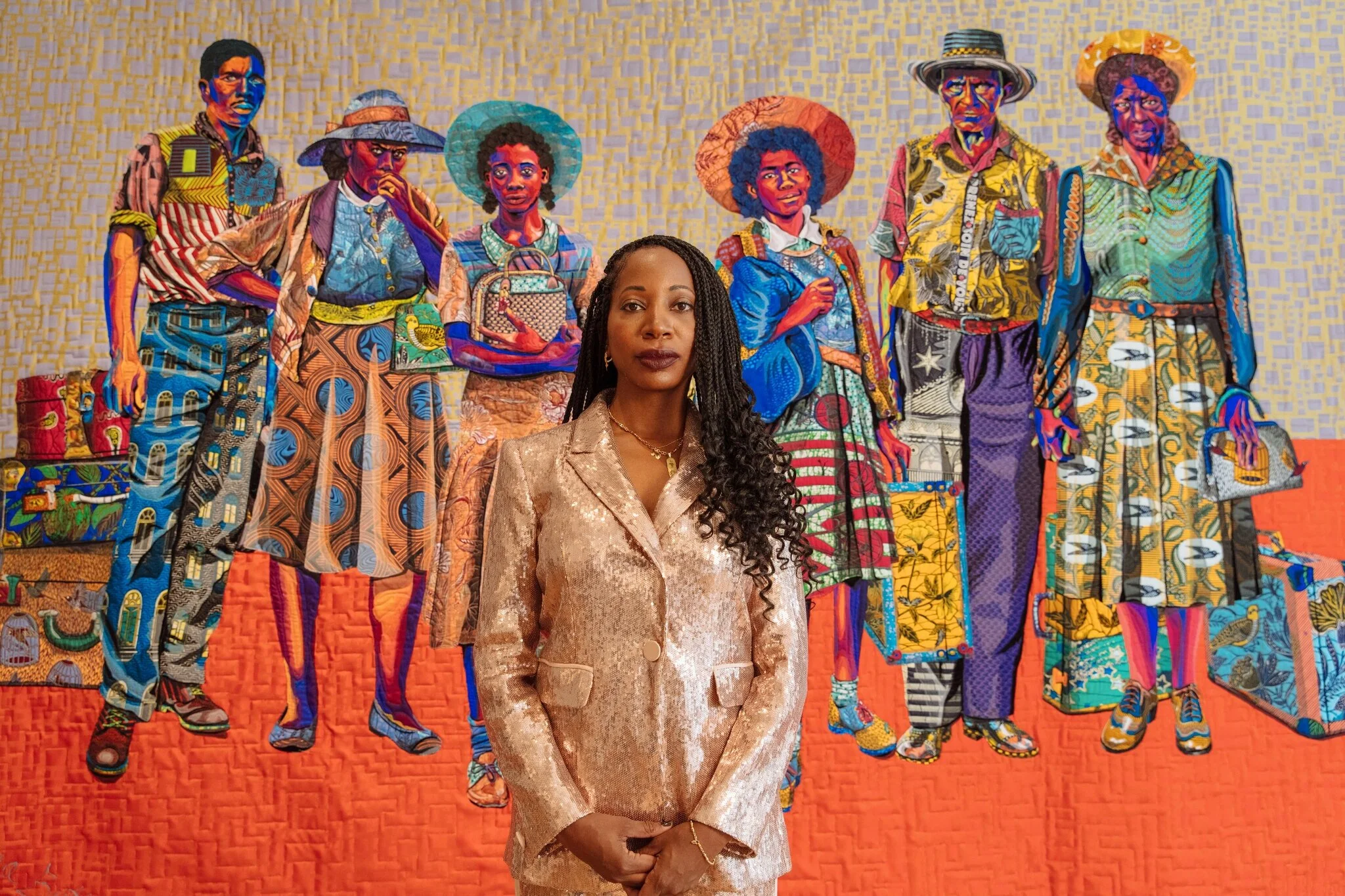 The artist Bisa Butler photographed in front of “The Warmth of Other Sons” (2020), one of her recent pieces exhibited at the Claire Oliver gallery in Harlem.Credit...Gioncarlo Valentine for The New York Times