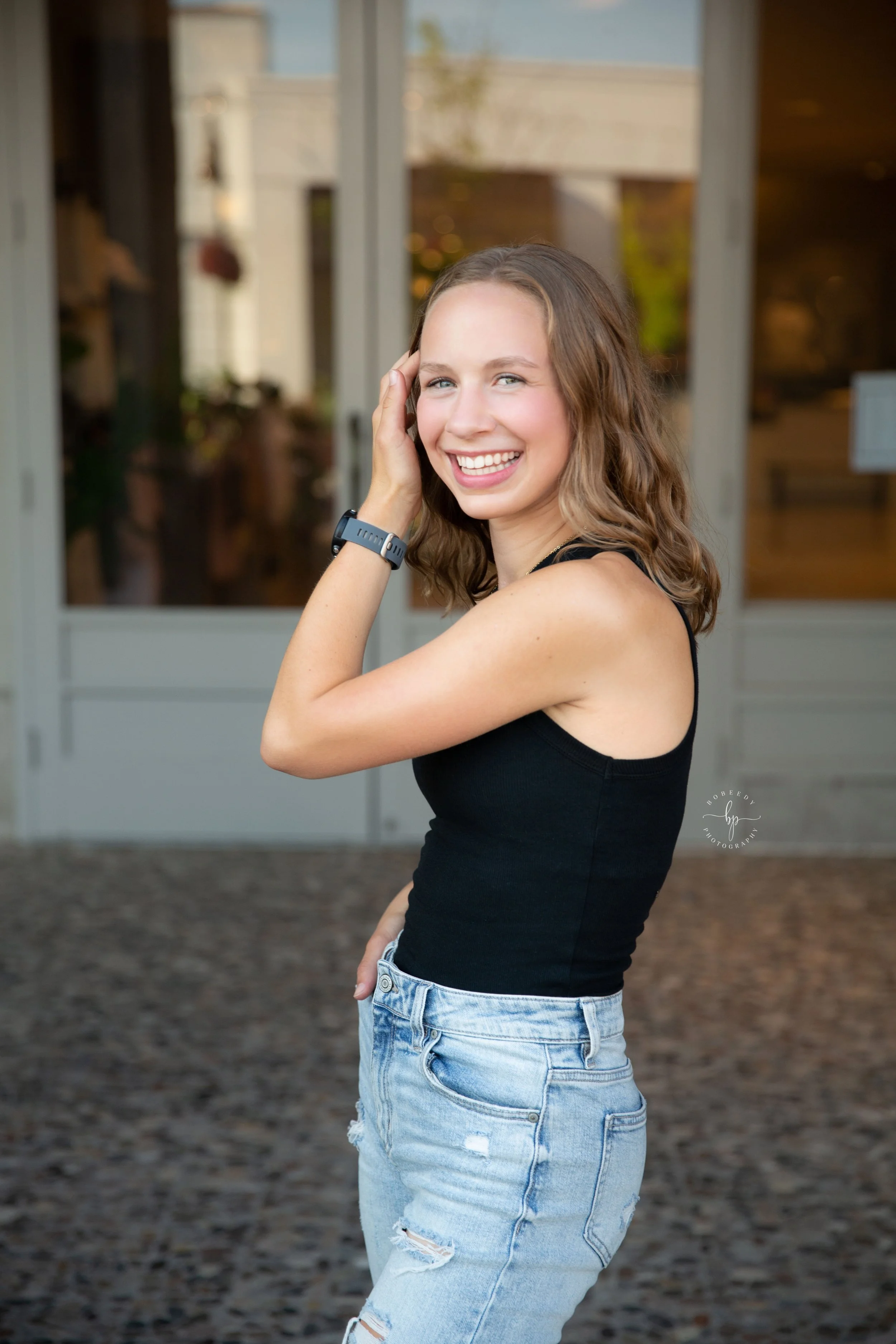 maple grove senior photographer arbor lakes shopping area girl poses
