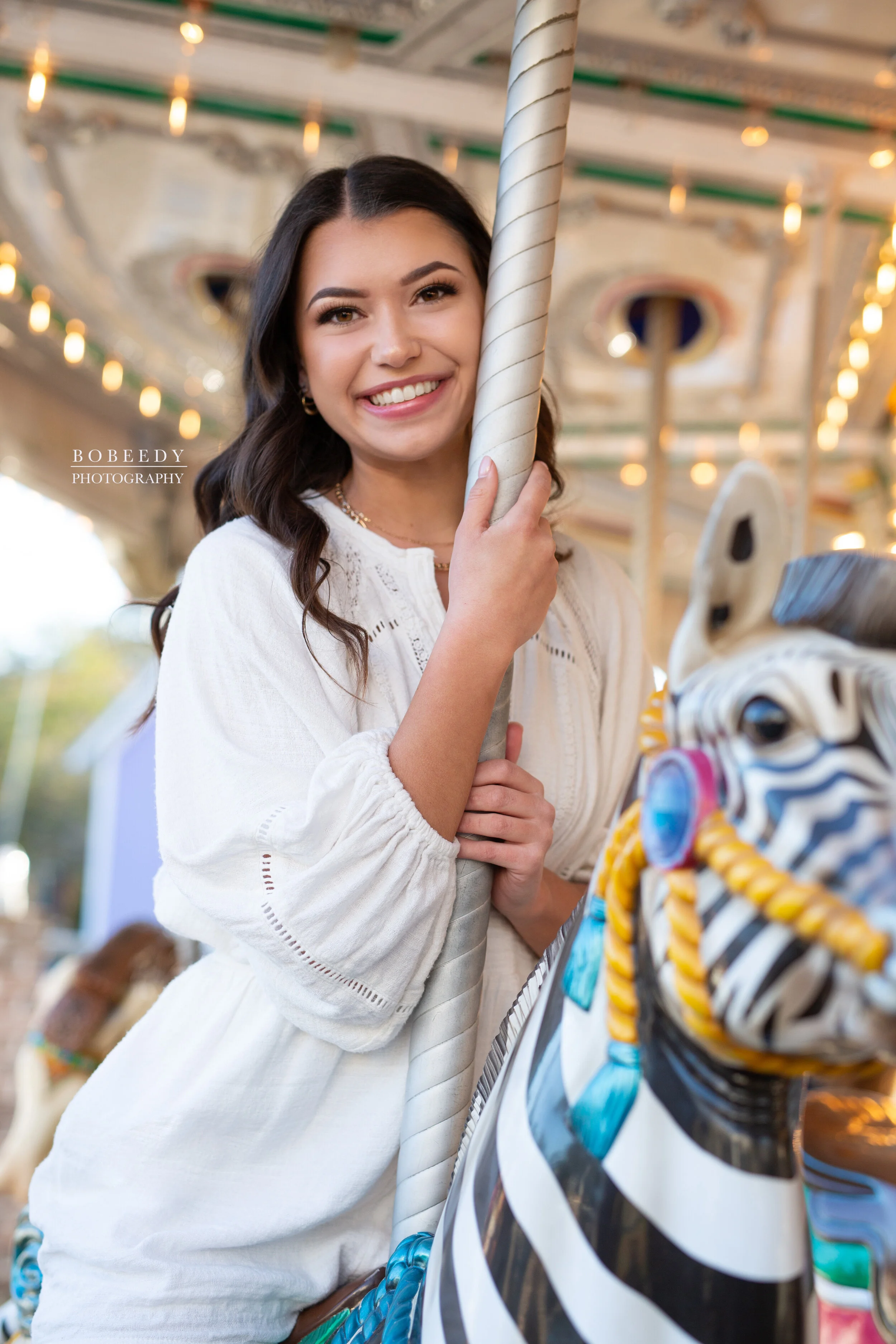 girl on carousel maple grove senior photographer