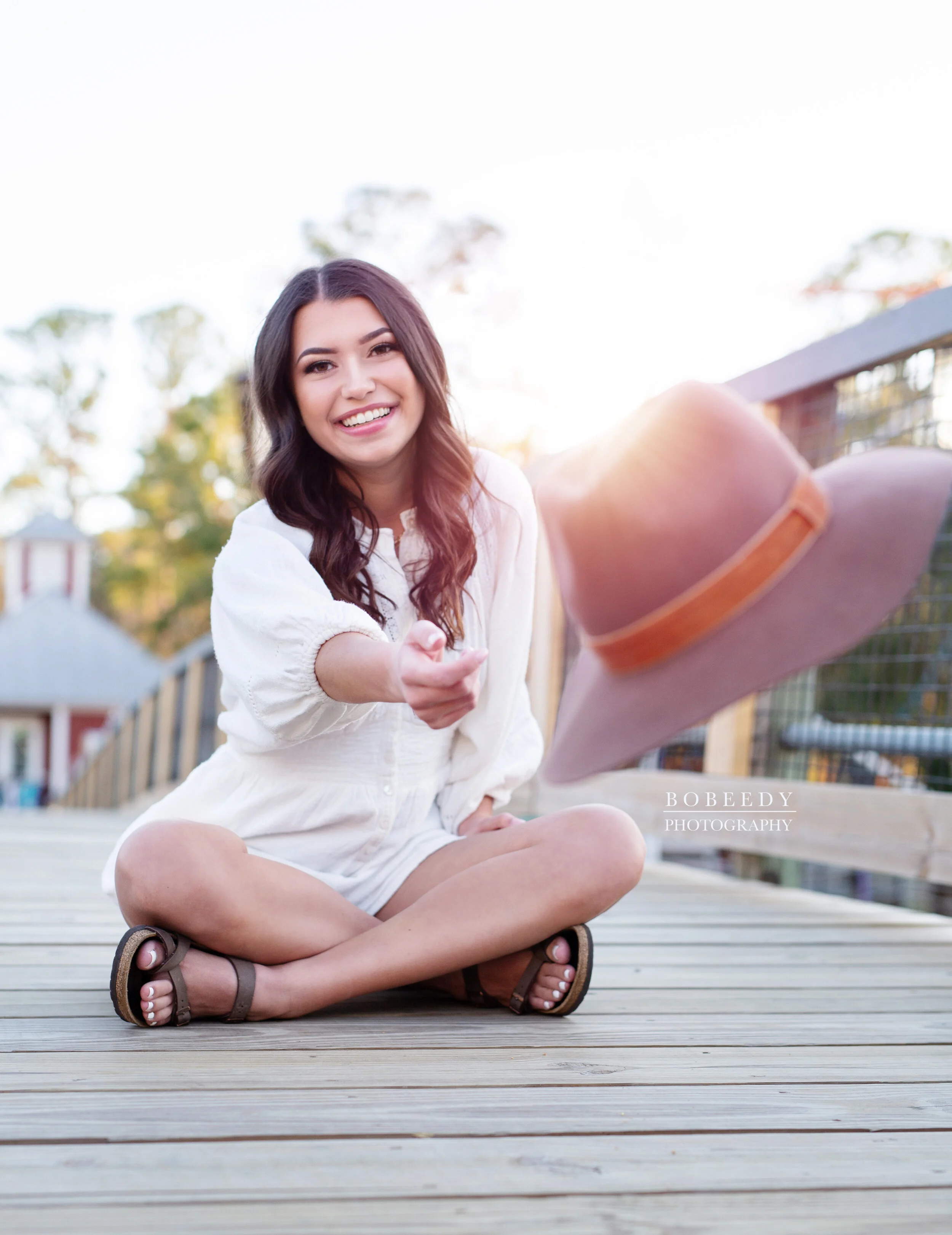 girl throwing hat maple grove senior photographer