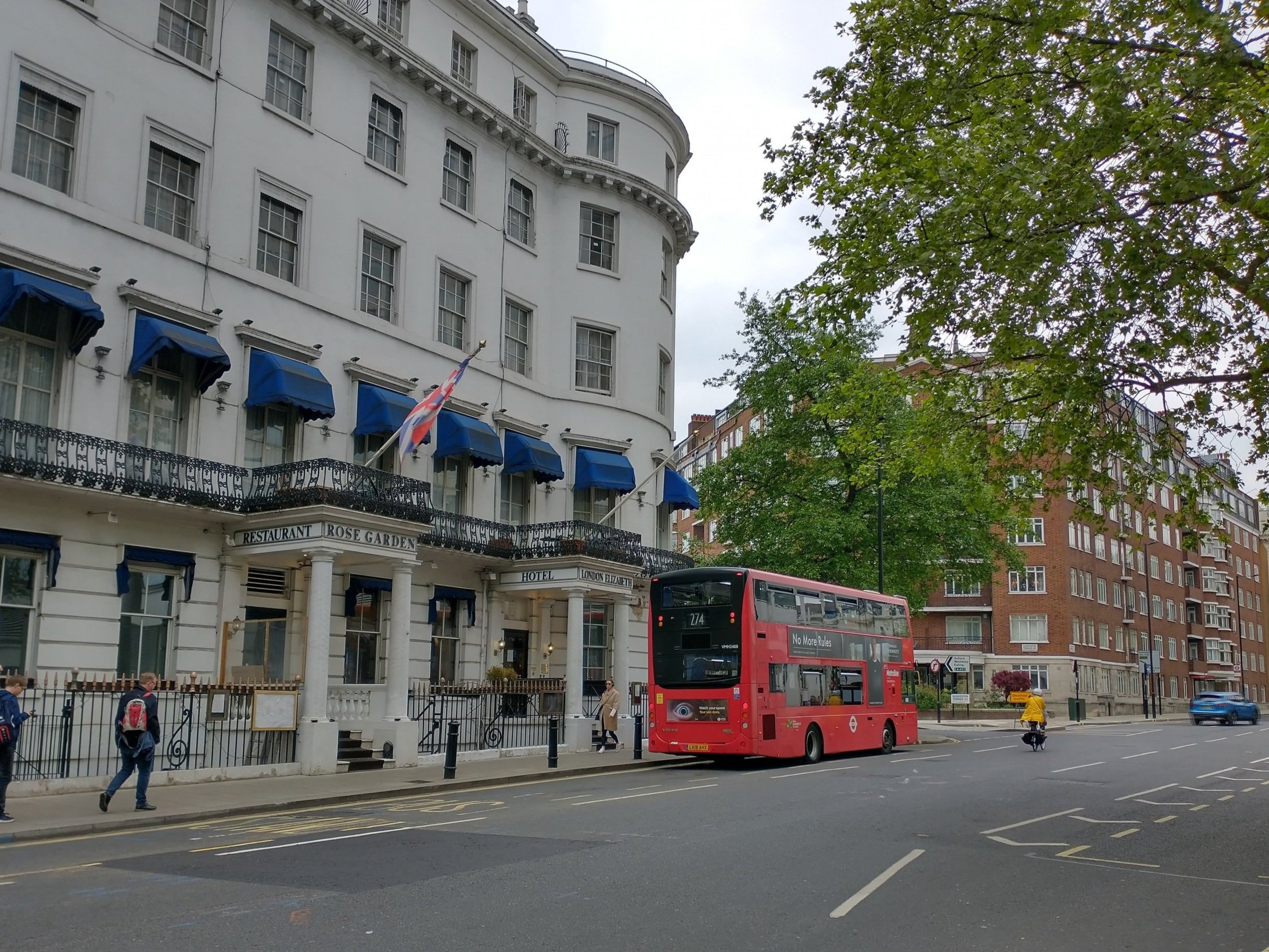 red-double-decker-bus-in-front-of-a-hotel-in-london