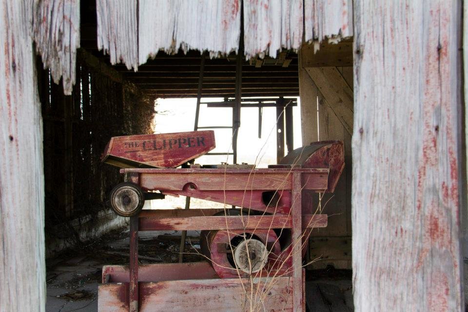 farm-equipment-in-abandoned-barn-in-indiana