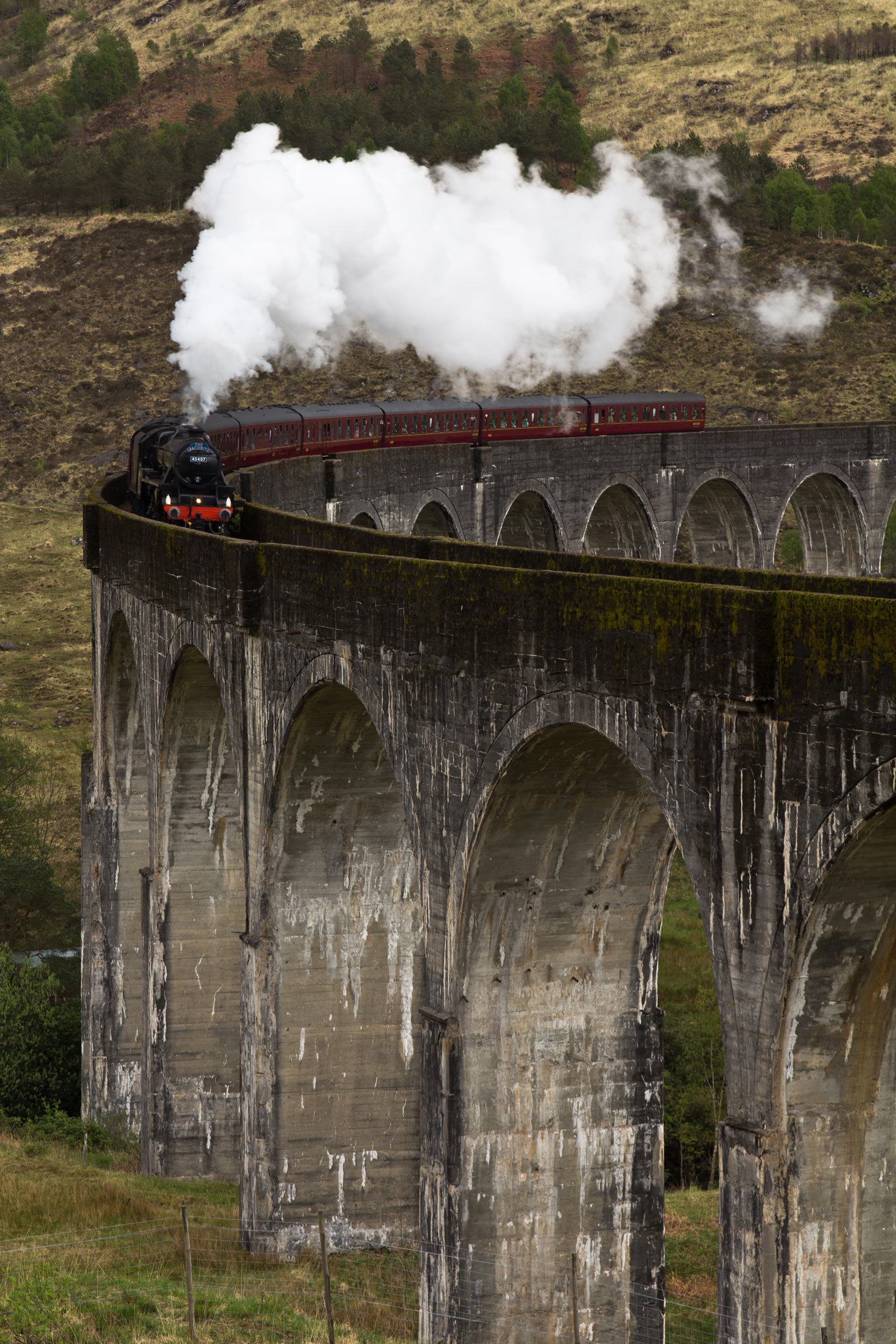 jacobite-steam-train-crossing-glenfinnan-viaduct-scotland