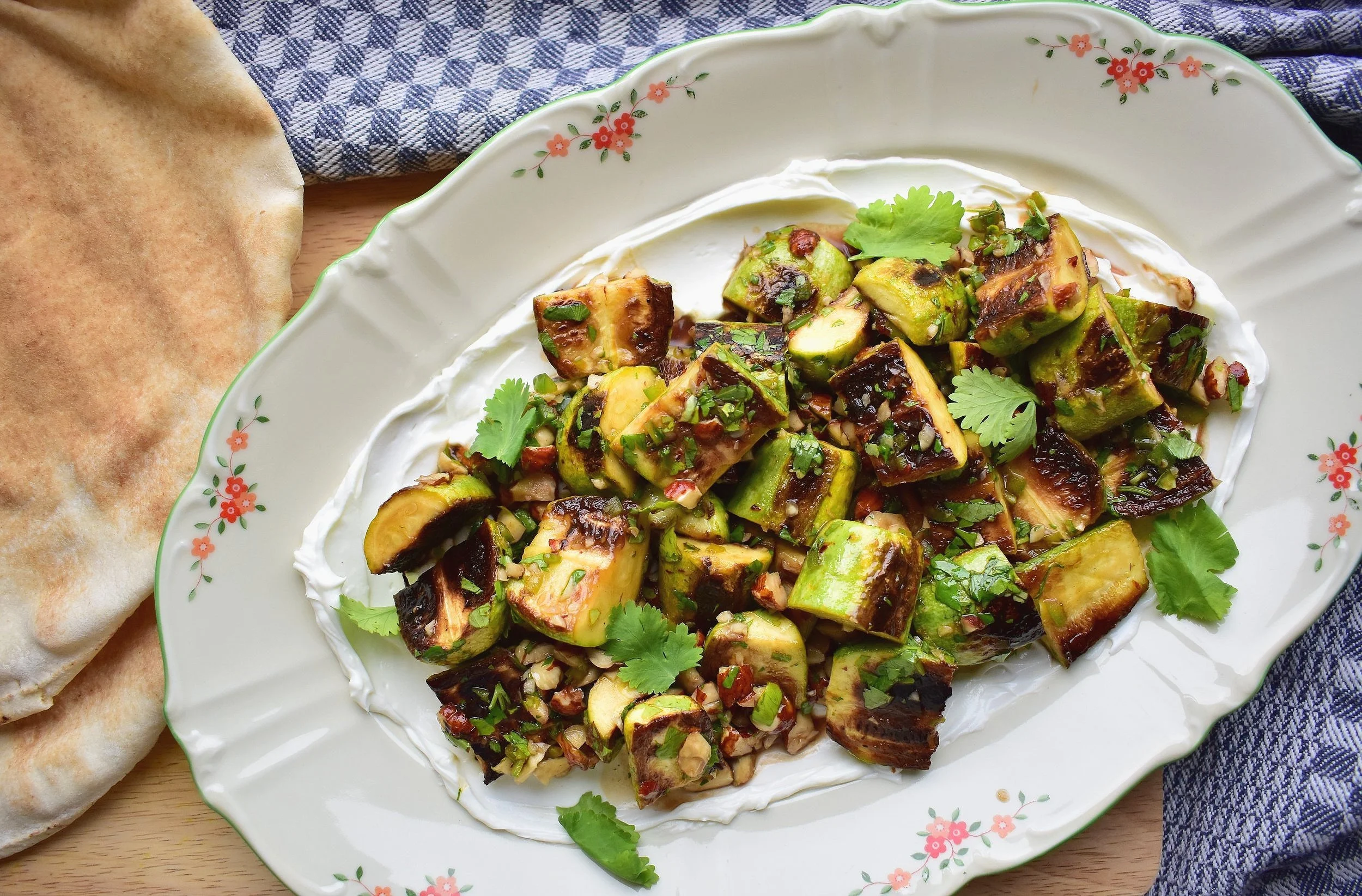 Charred Squash with Labneh, Hazelnuts, and Pomegranate Molasses