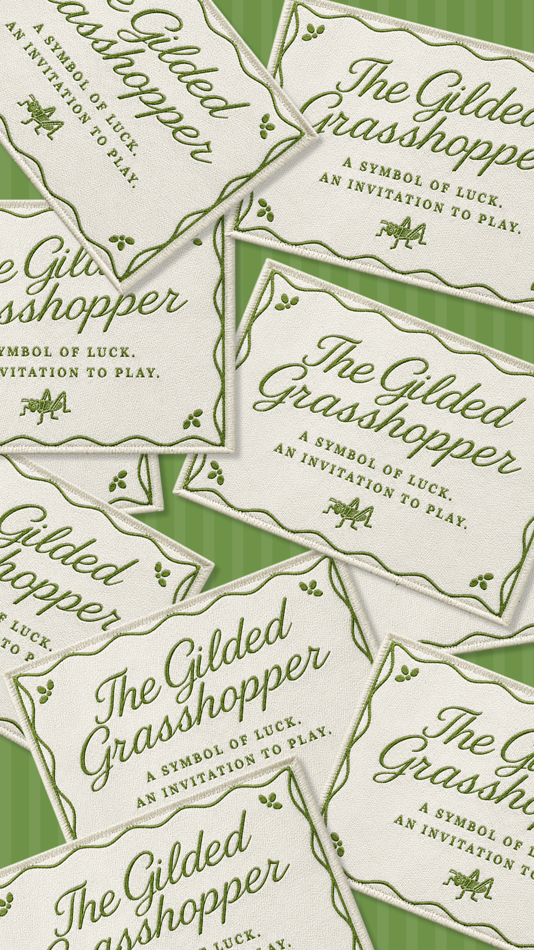 Embroidered woven labels for The Gilded Grasshopper with script logo, tagline, and grasshopper icon, custom product tag design