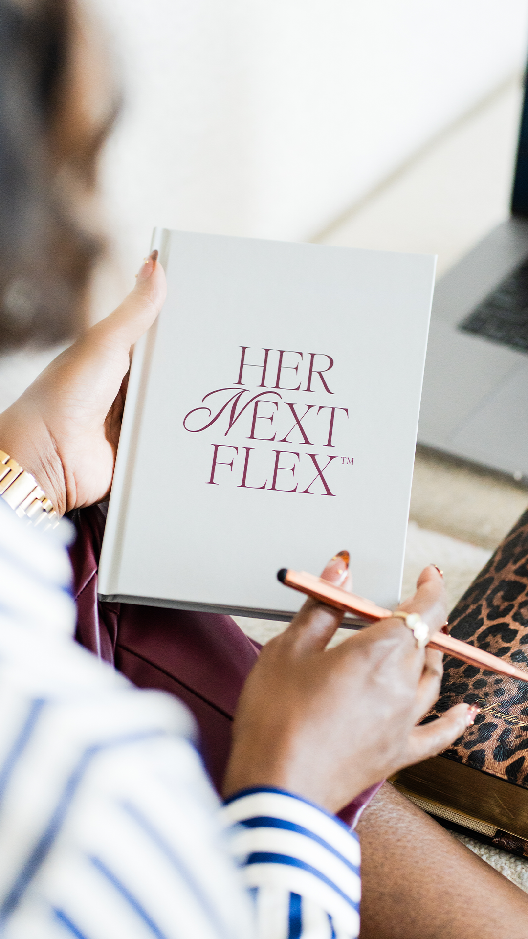 Woman journaling in a Her Next Flex branded notebook, lifestyle brand photography for a women's coaching business