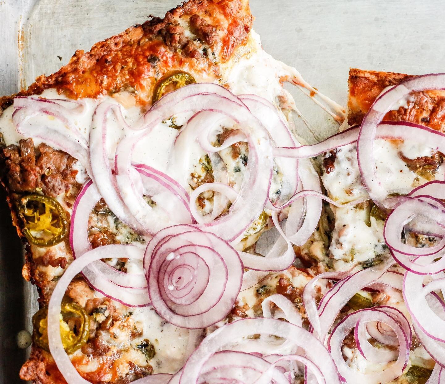 It&rsquo;s a hot mess and we love it, folks. Make sure you try our current feature before it&rsquo;s gone again! BOEUF &amp; BLEU : seasoned ground beef, blue cheese, pickled jalape&ntilde;o, shaved red onion, buttermilk blue cheese drizzle, mozza, t