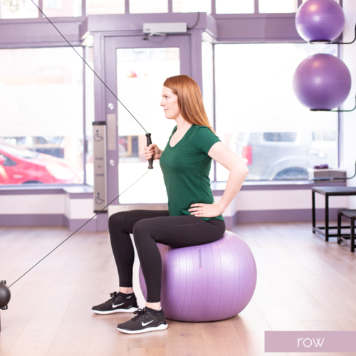 RowSitting on a box, bench or swiss ball, face a cable machine or resistance band shut into a door. Exhale and pull the cable back, letting the elbow stop just by the rib cage.