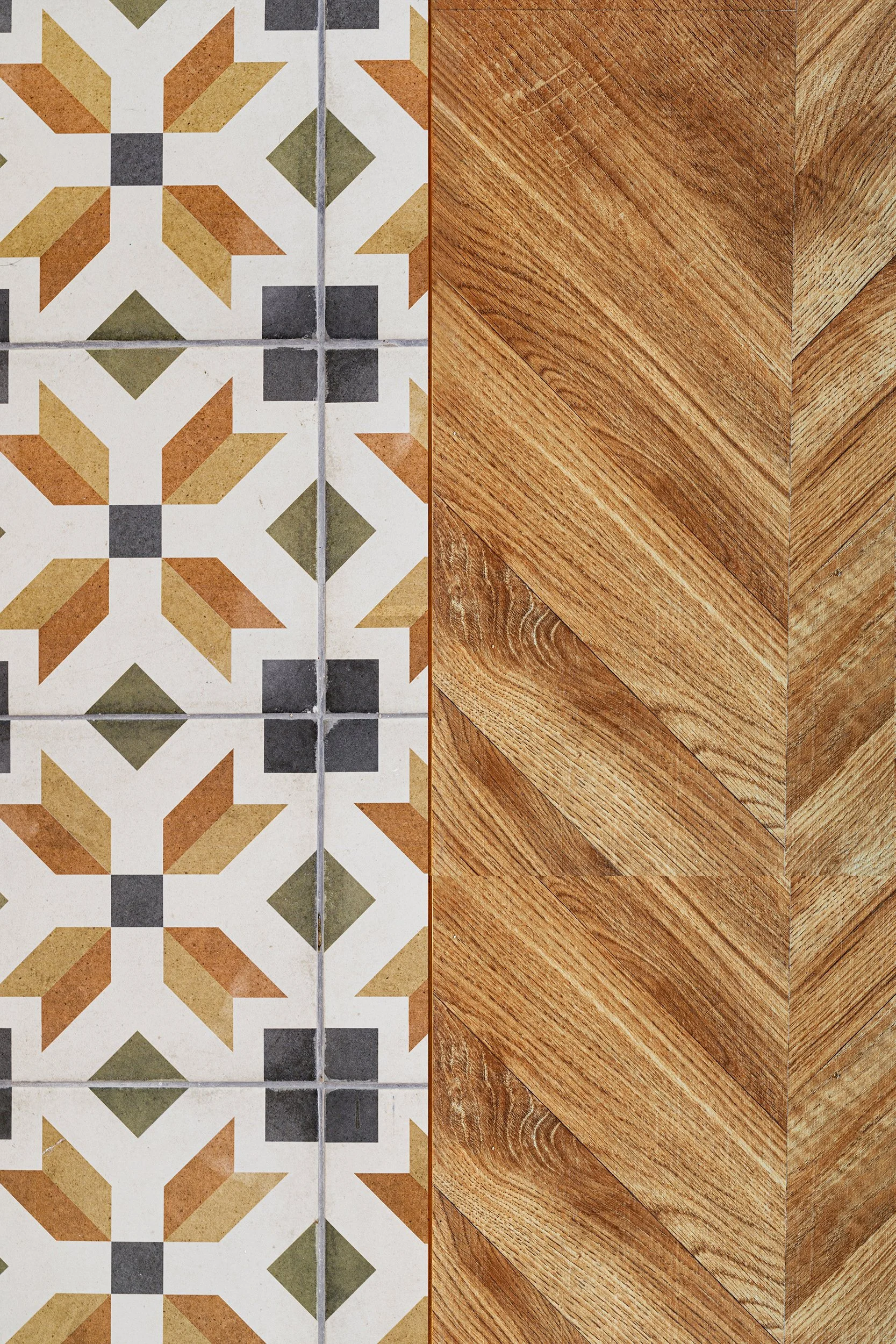 Geometric tile pattern next to wood-like flooring