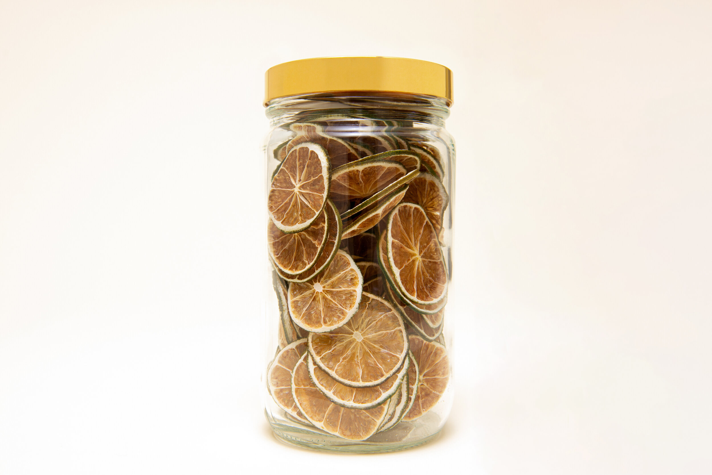 Jar of fine dehydrated lime garnishes for cocktails | DEHY Garnish