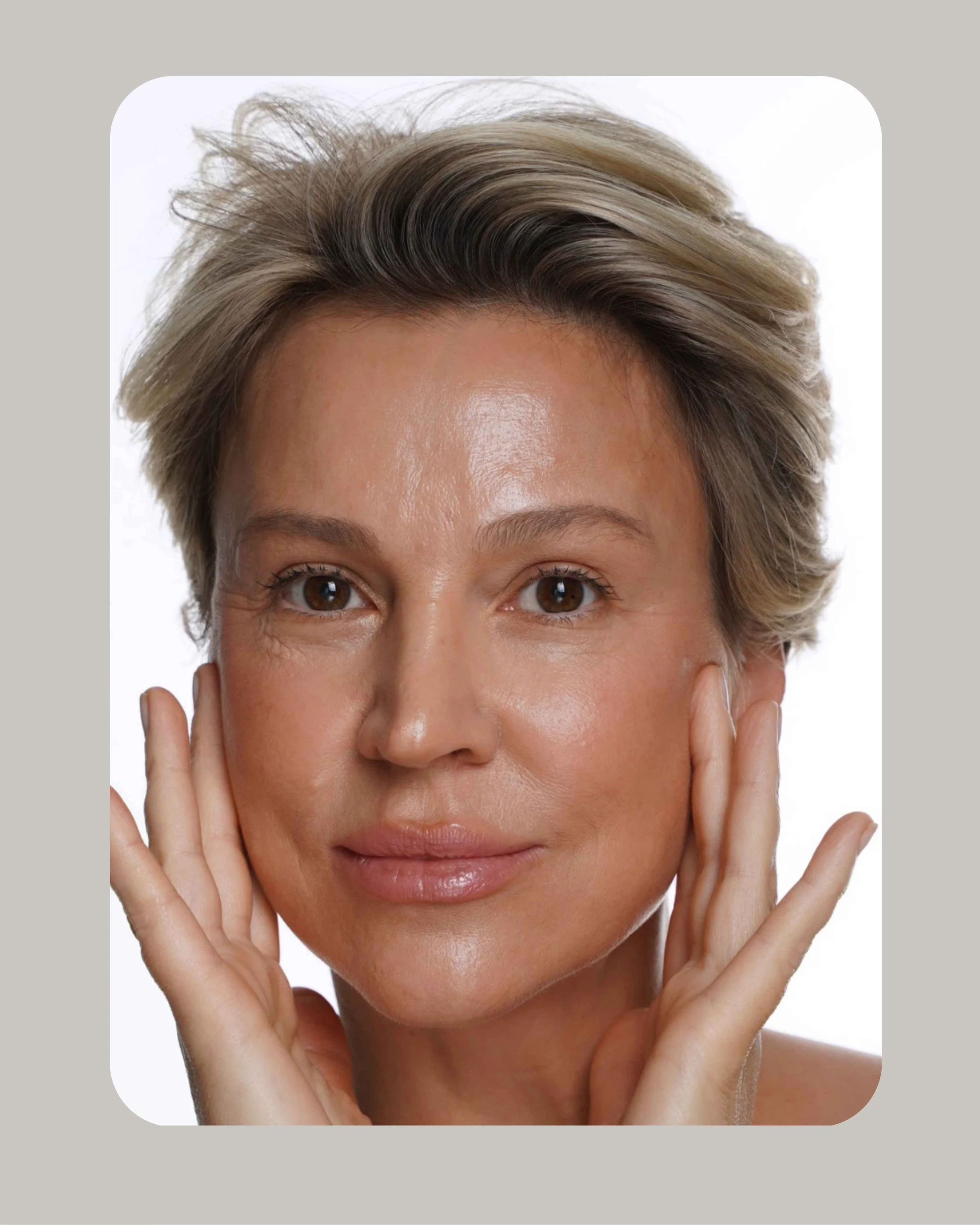 Person receiving facial massage, wearing a headband, with hands in gloves applying gentle pressure.