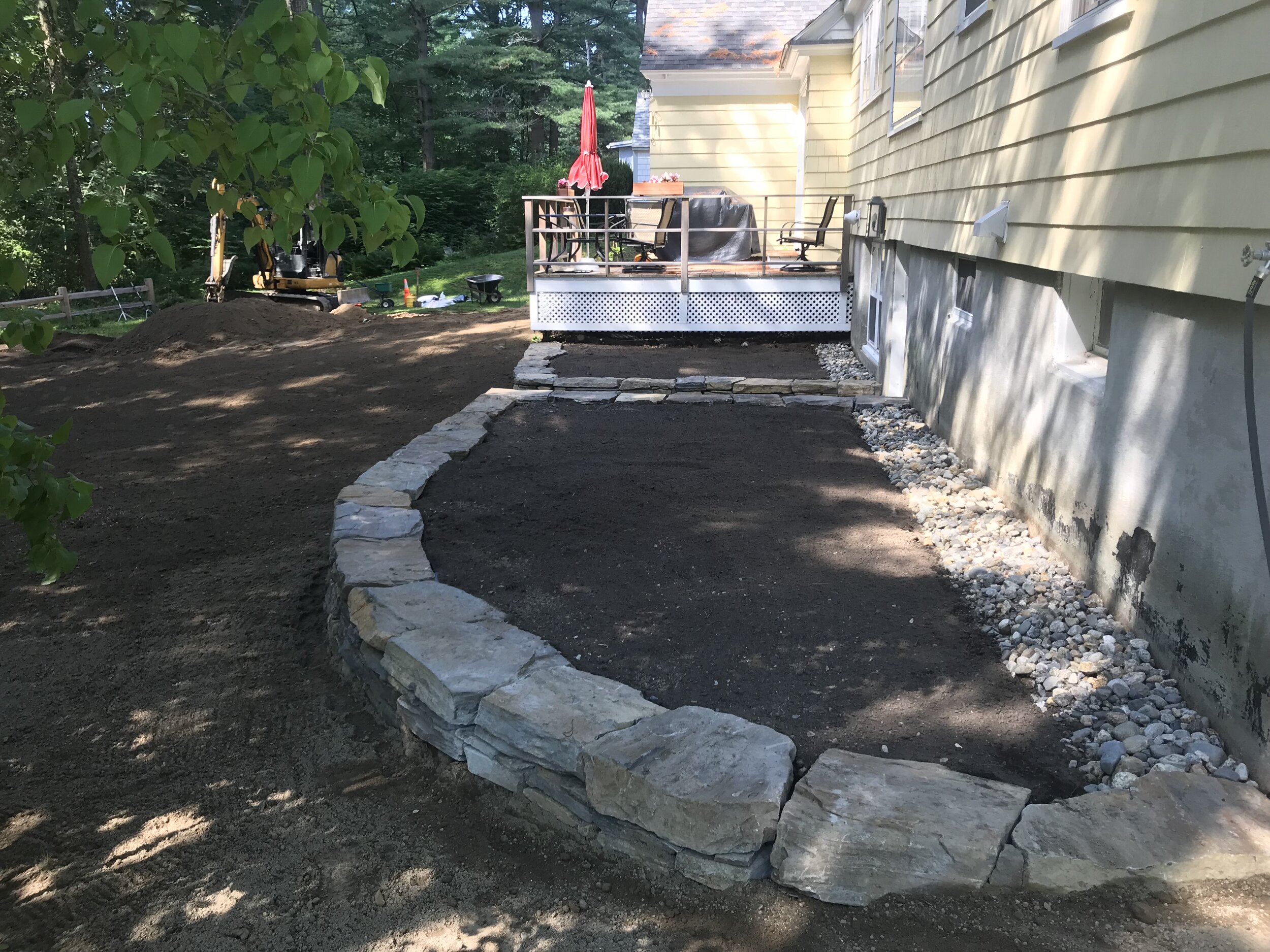 Dry laid natural stone retaining wall