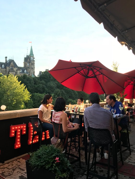 People dining with view of Parliament La Terrasse Fairmont Chateau Laurier best Ottawa patios