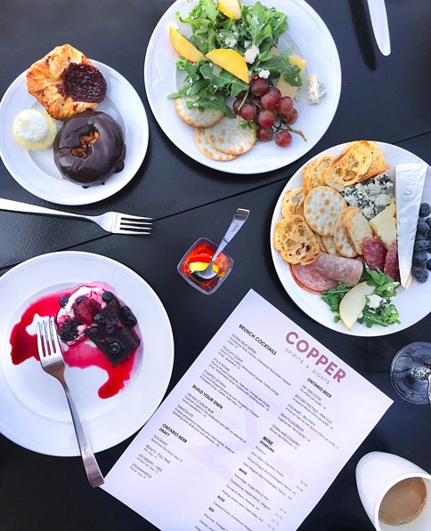 Table with food and menu Copper Spirits and Sights Andaz Ottawa best patios