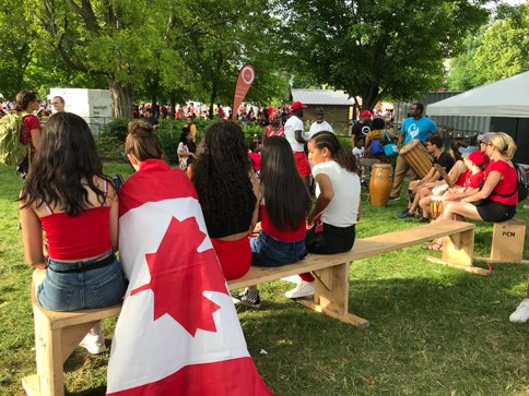 Girls sitting on bench Canada Day Ottawa