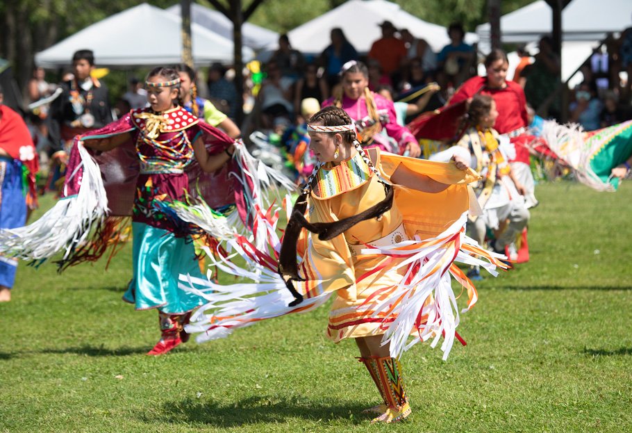 Indigenous women dancing in fancy shawl at the Wiikwemkoong Cultural Festival Manitoulin Island