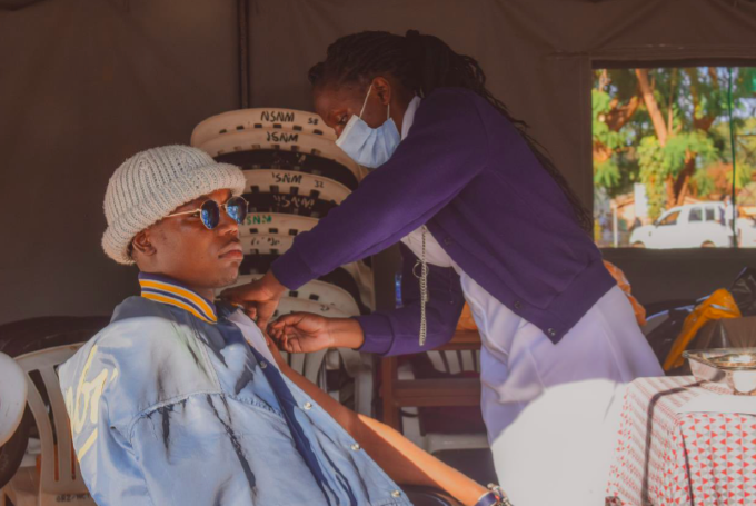Lewis Katota, a student getting the vaccine jab