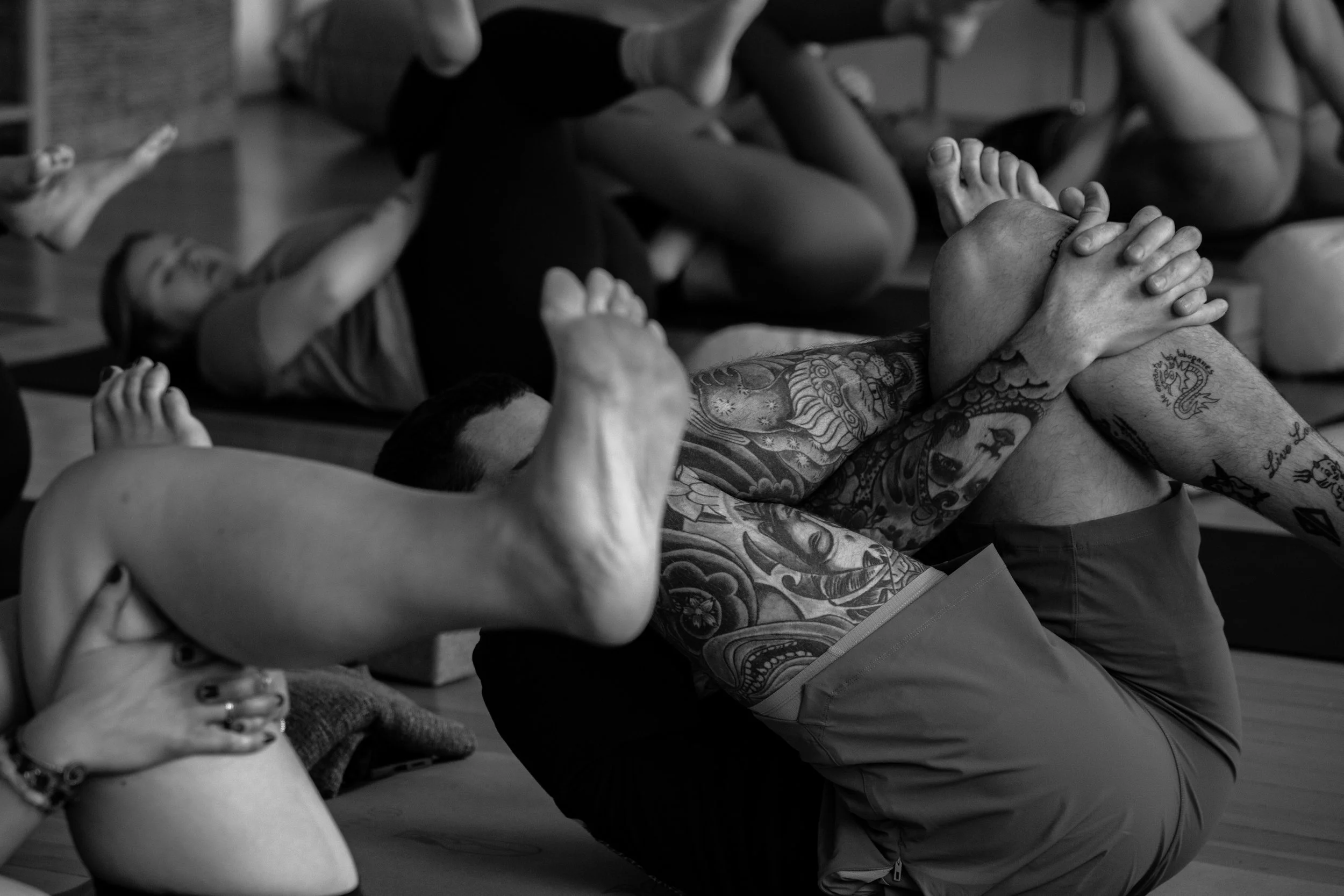 Yoga class members stretching together at Reset studio