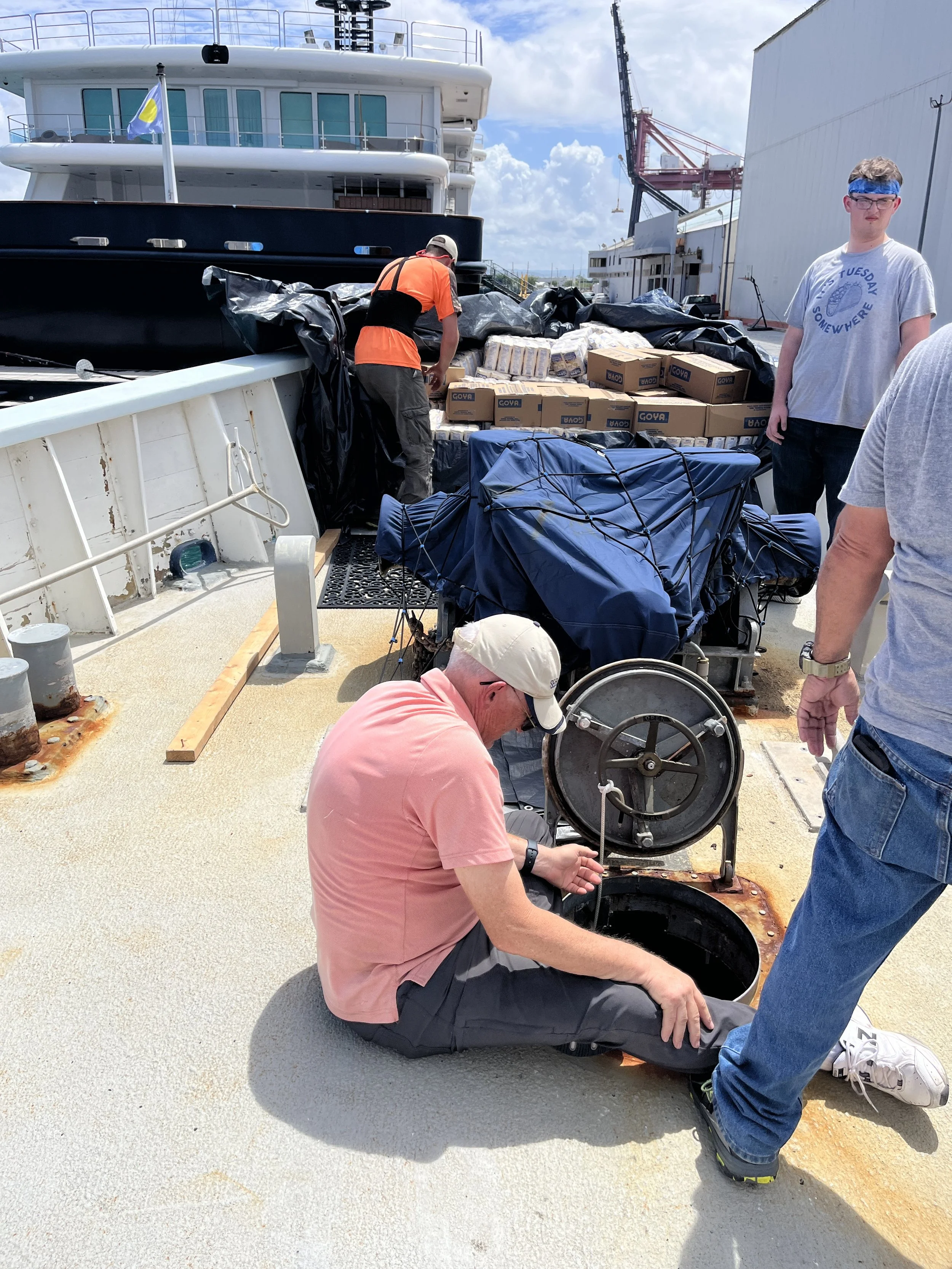  Dropping boxes of beans into the bow berthing 