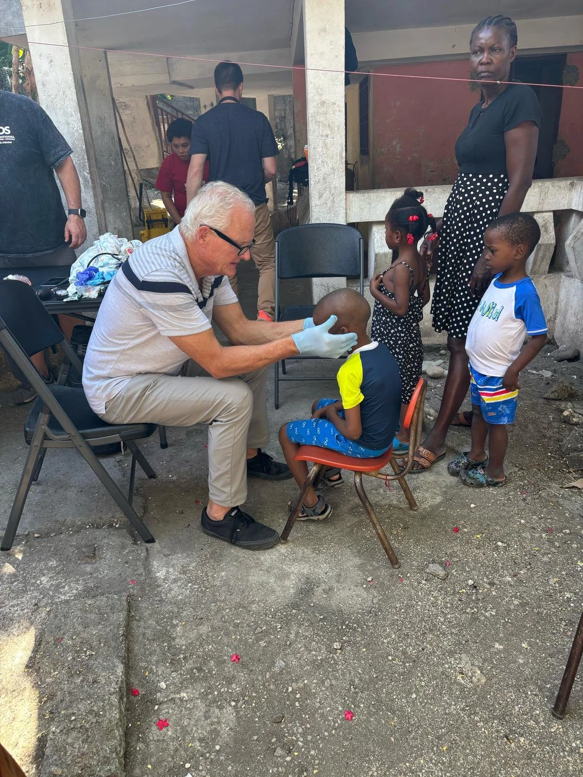  Dr. Reid doing a medical exam at the Children’s Home 