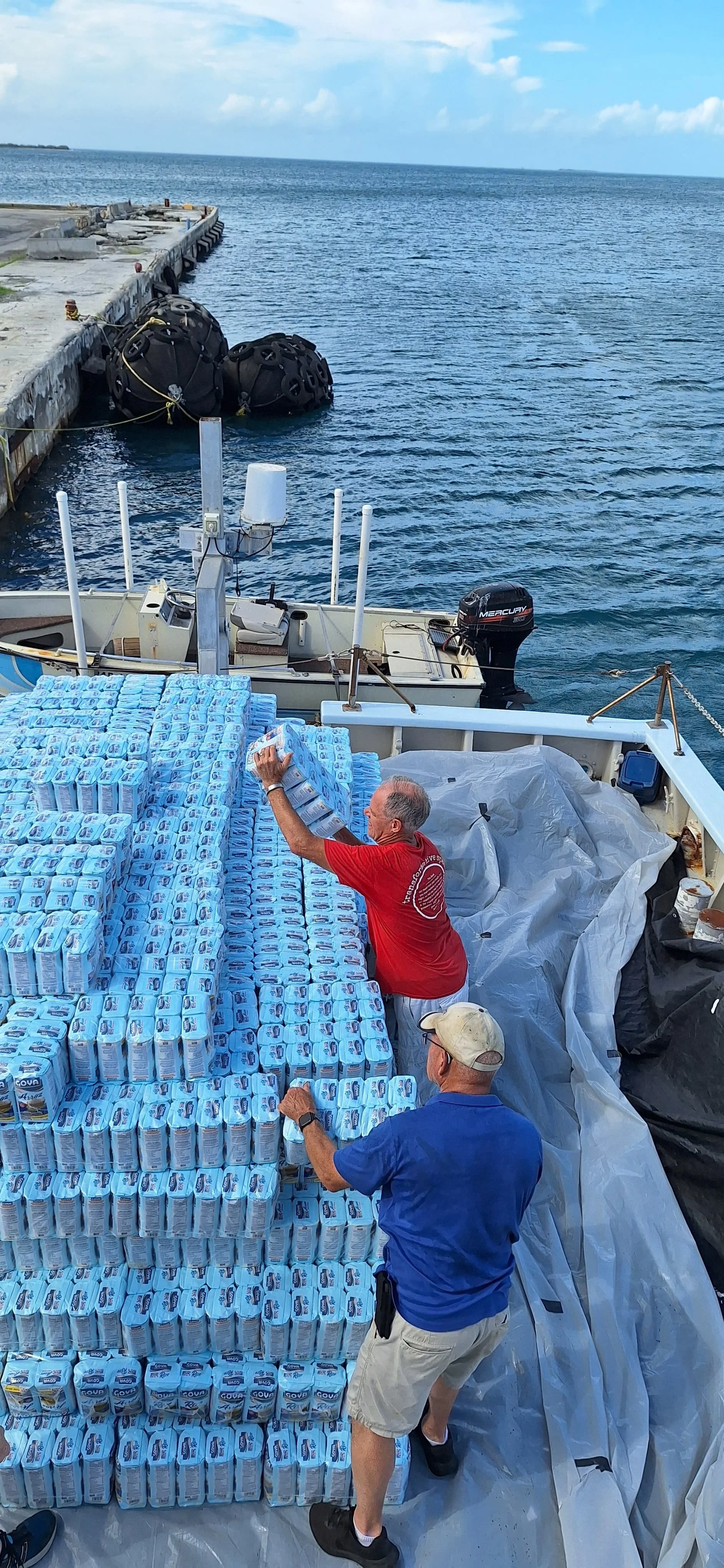 Finishing putting on 3 pallets of bean and 3 pallets of rice