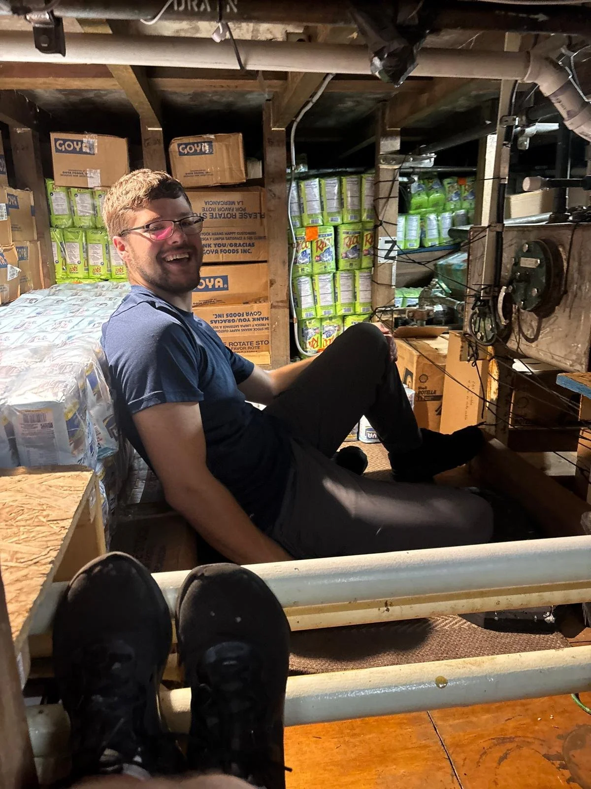 Putting rice and beans in our bilge stowage area