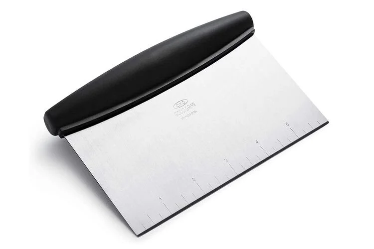 Metal bench scraper with a black plastic handle.