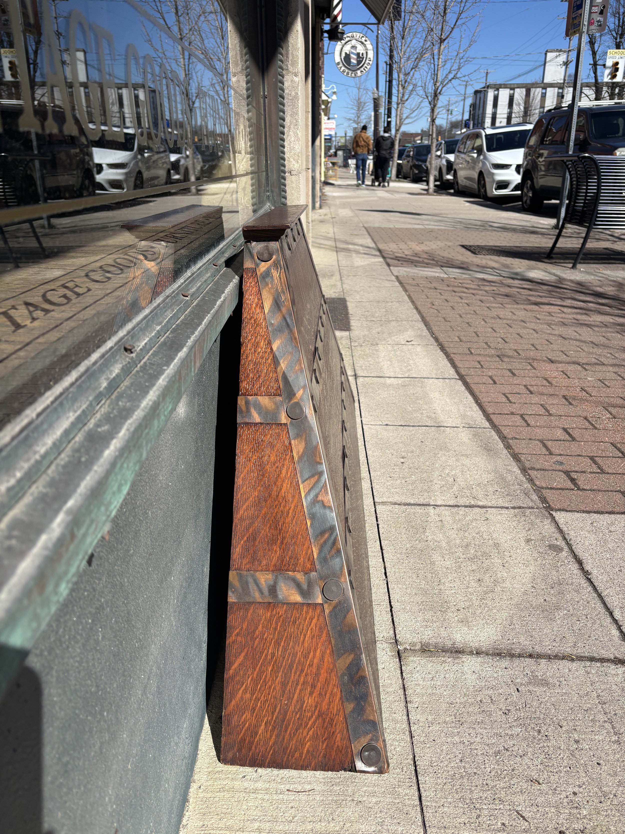 Side profile of Arts and Crafts fireplace hood showing depth and sloped architectural form