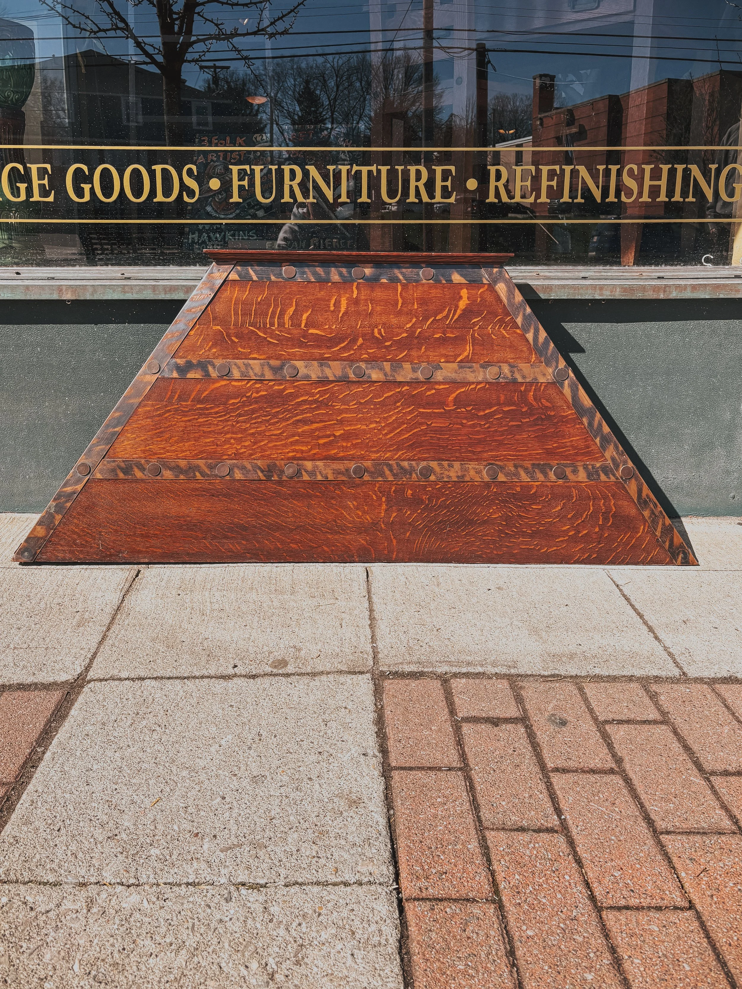 Antique Mission style fireplace hood in quarter sawn oak with copper detailing and riveted accents