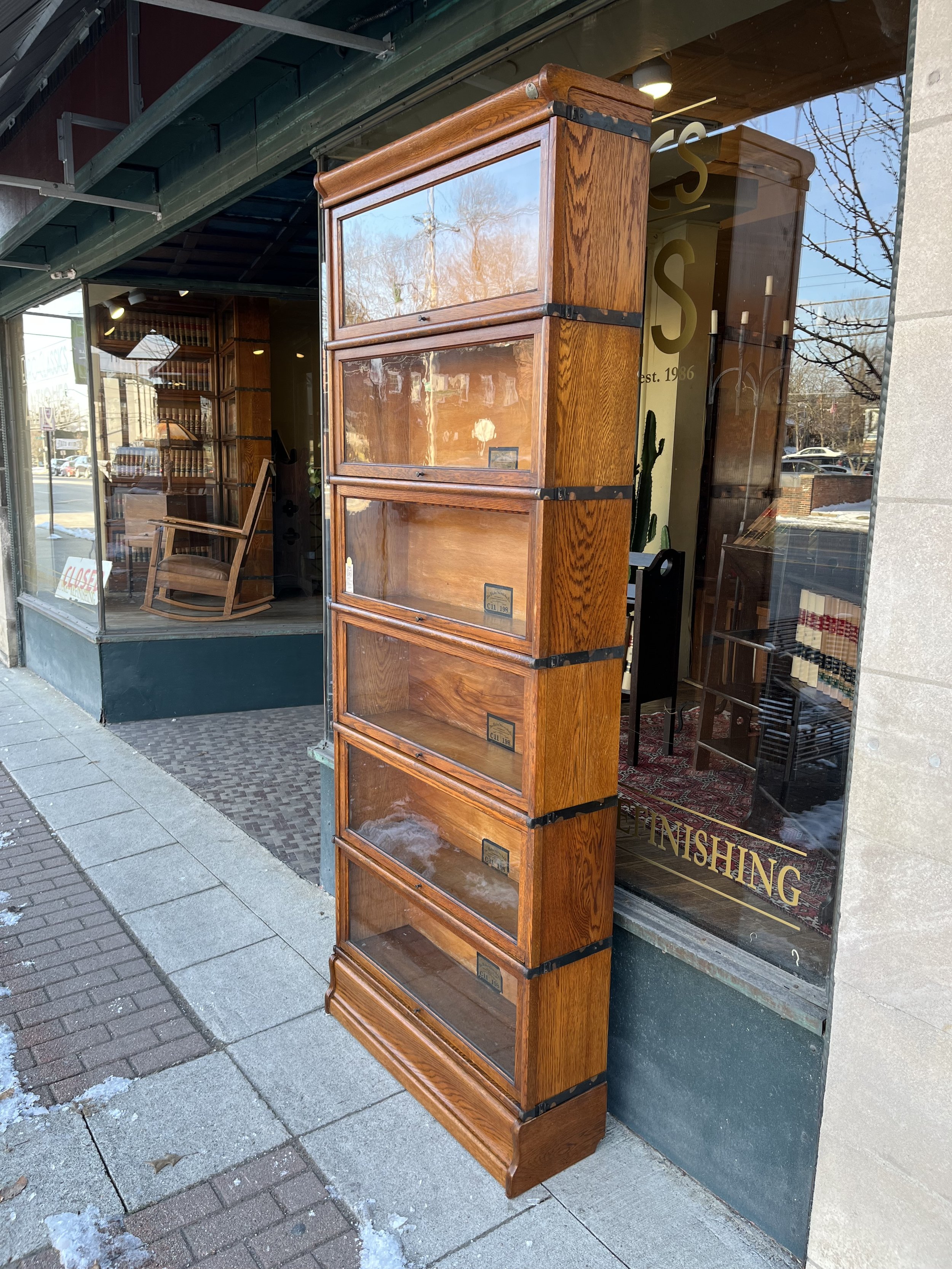 Full-length image of the antique oak Globe Wernicke bookcase, a rare courthouse artifact with a storied past, ideal for collectors and history enthusiasts