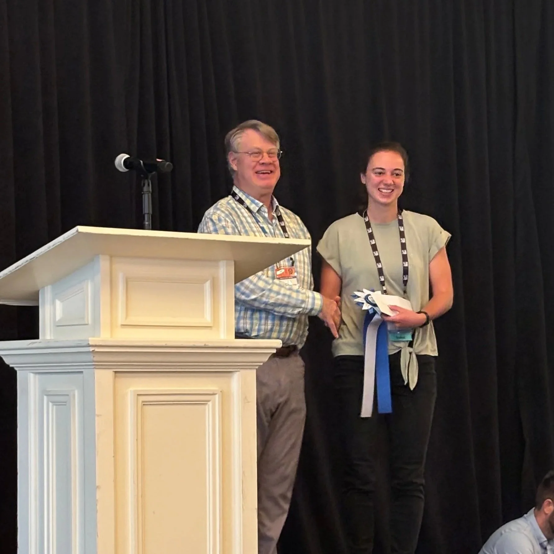  Theresa accepting Best Poster Award from Dr. Ben Van Houten 