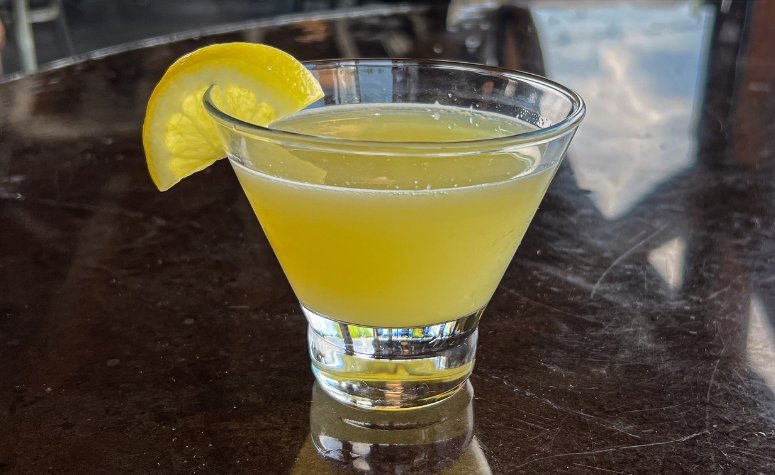 Lemon Drop Martini cocktail from Royal Bliss with Vodka, simple syrup and lemon juice served with a sugar rim.