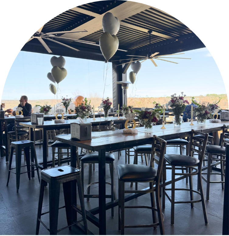 Private event space at Royal Bliss Brewing featuring covered rooftop terrace with tables overlooking Lake Norman area in Denver, NC.