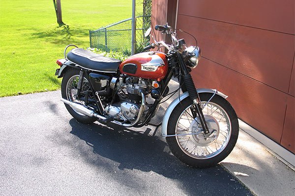 Red and silver Triumph motorcycle