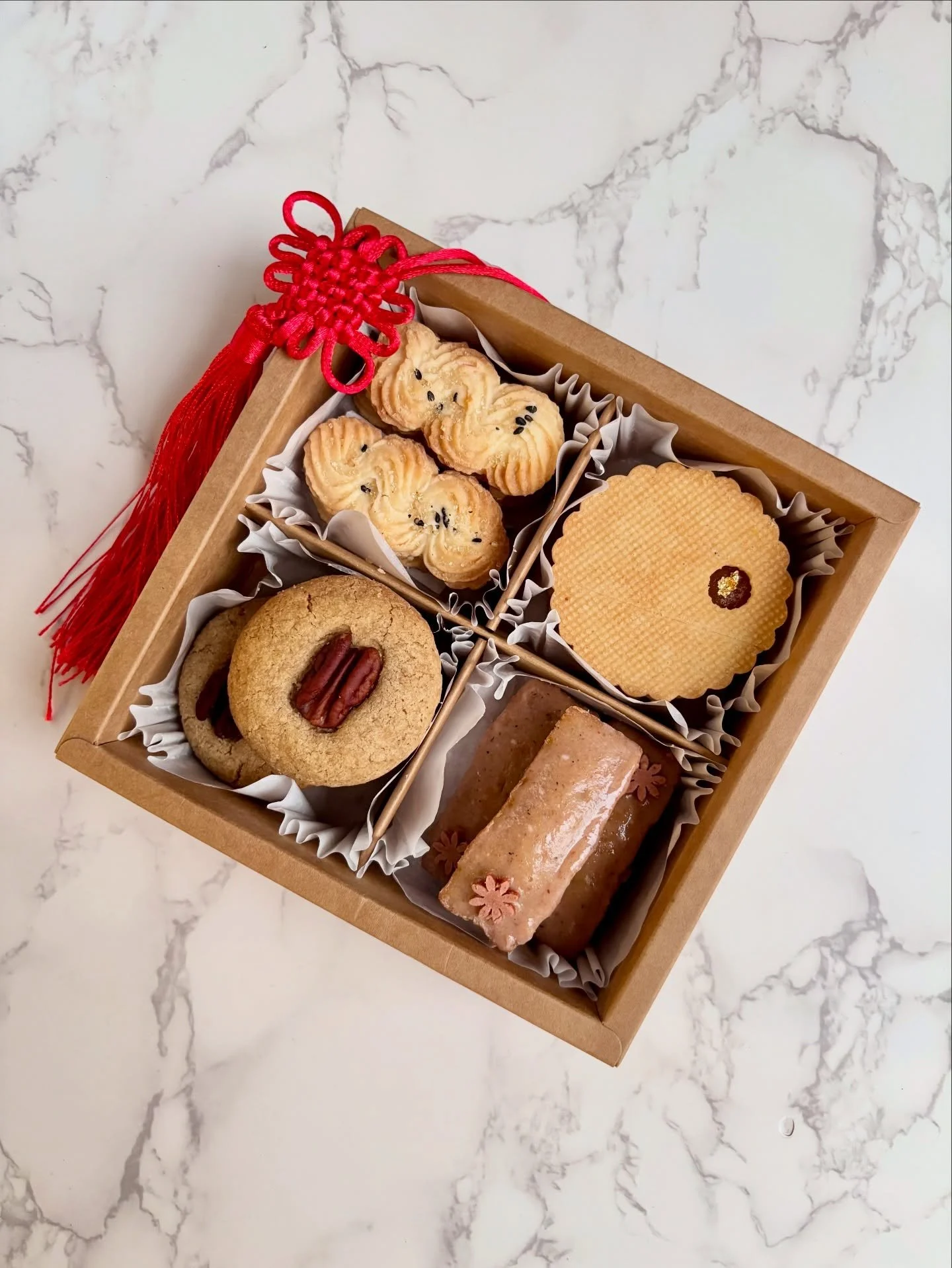 Prosperity Treat Box 💫🧧

Celebrate Lunar New Year with this delicious assortment of treats! Each box contains (14) assorted sweets:

-Salted egg yolk butter cookies 
-Pineapple Osmanthus linzers 
-Coffee pecan shortbread 
-Pistachio hawthorn financ
