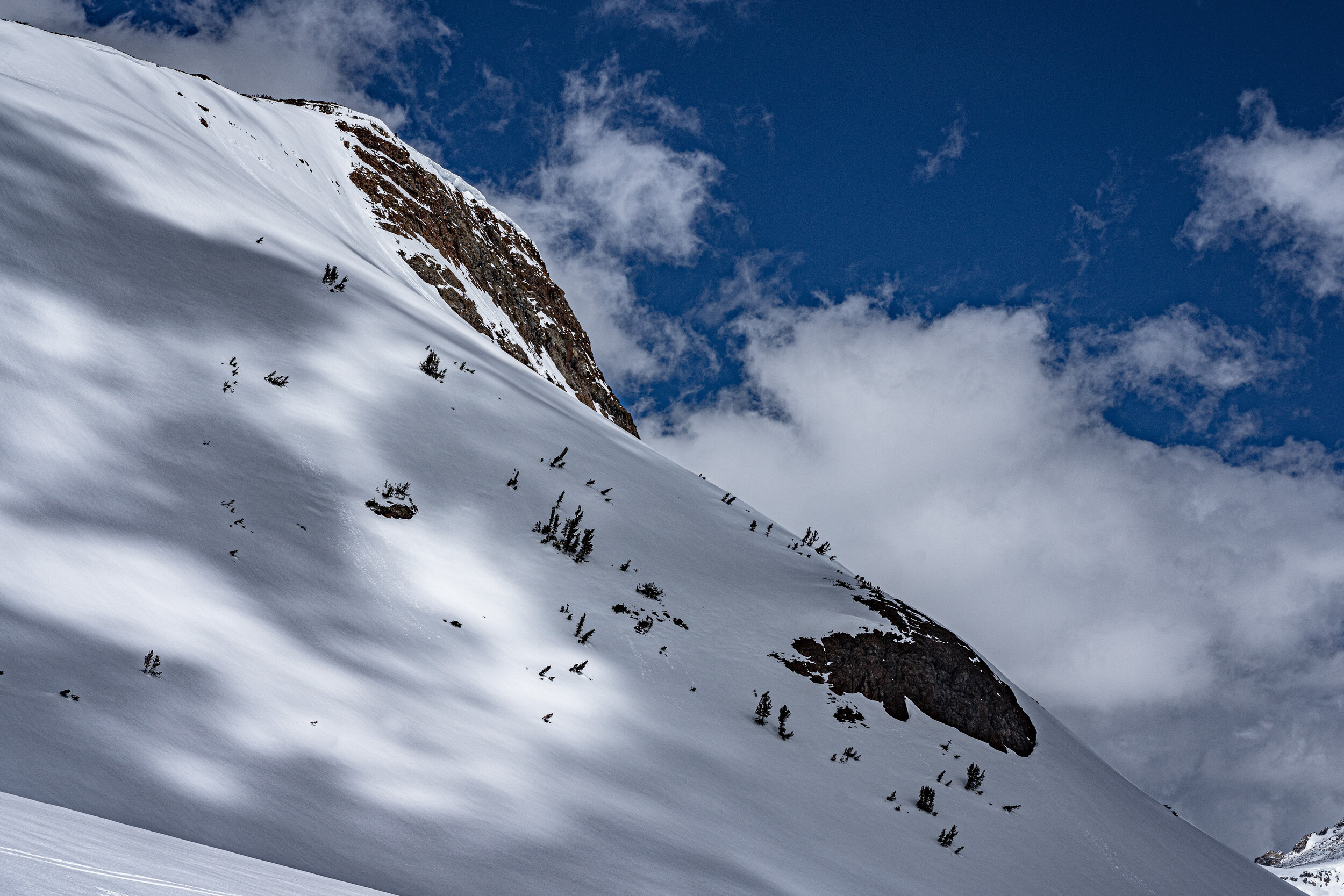  The combination of cornices overhanging our intended route and warm sun made us reconsider our plans.  