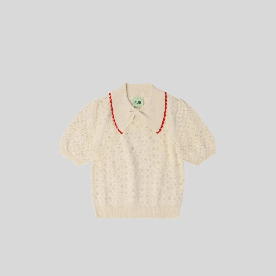 Lovely pointelle polo with a bow collar made from extra fine merino wool. 

100% OEKOTEX&reg;, RWS and BLUESIGN&reg; certified merino wool

@fubkids