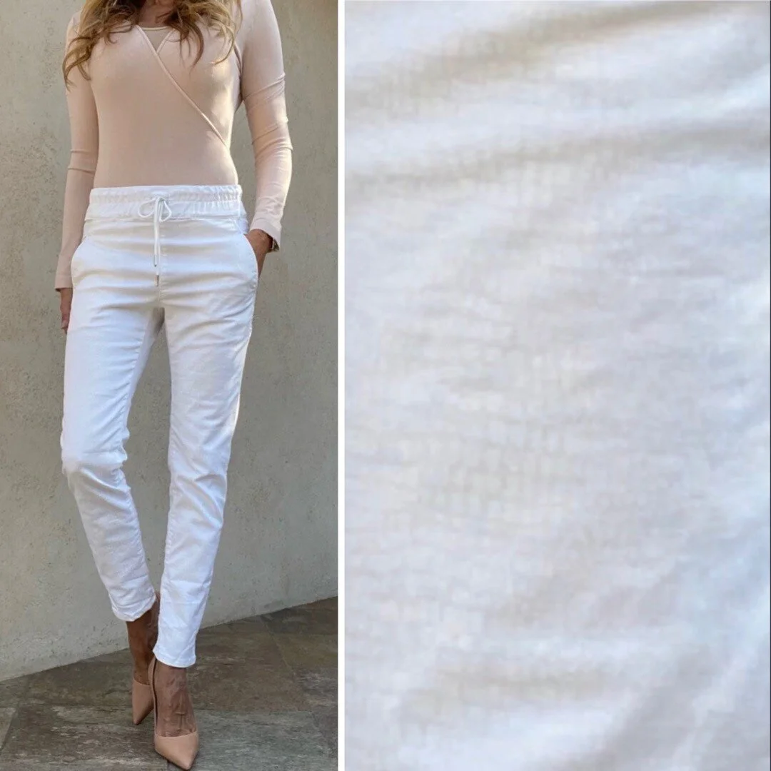Your new favorite pant just dropped. These AMAZING pants have the style of a jogger but with a very chic snake print done in a lightweight fabrication. Wear them during the day running errands with a sneaker and then pair them with a heel for a dress