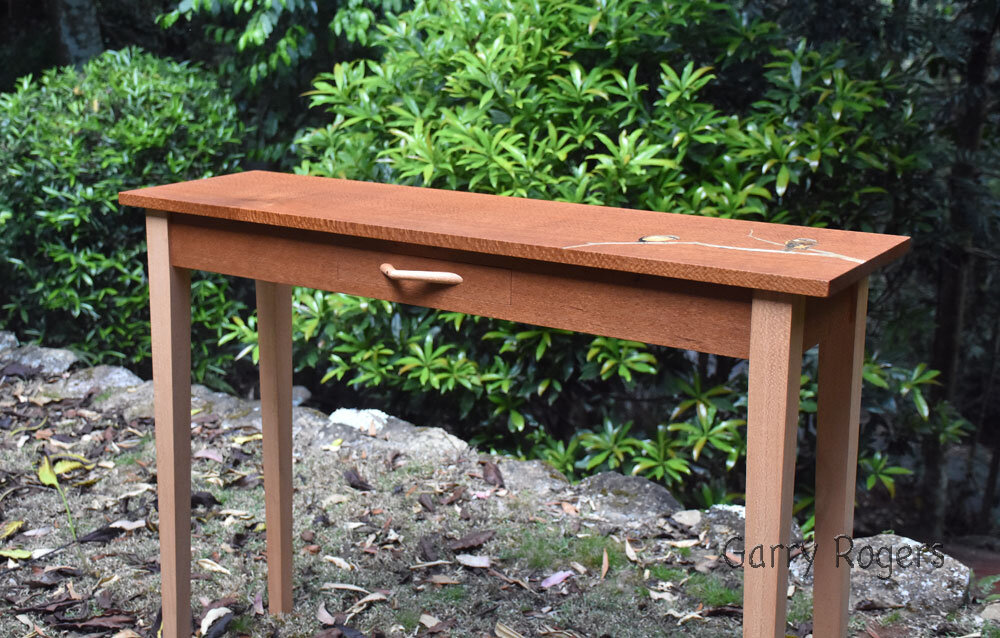 Contrasting timbers of the Yellow Robin Hall table.