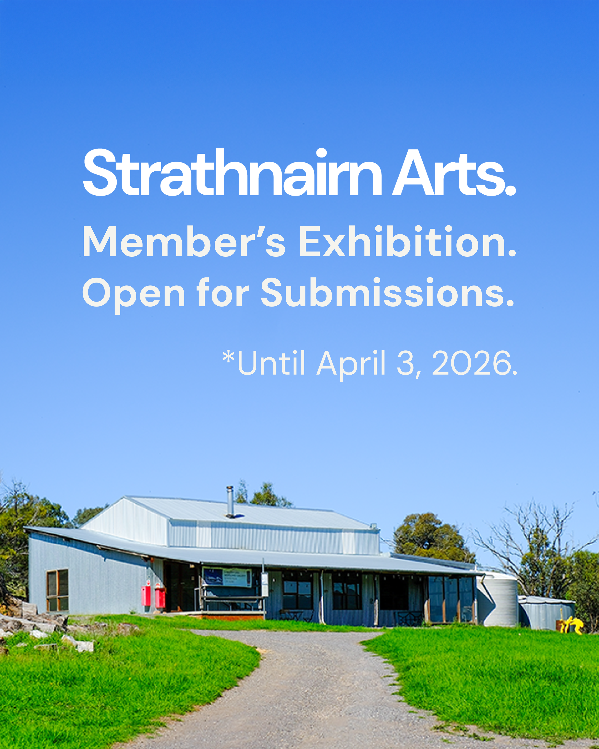 Corrugated iron shearing shed building on a green grassy hill