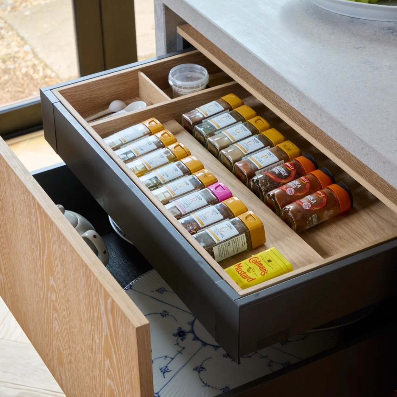 Drawer boxes with bespoke inserts, designed around how you actually live. From specific spice jars to that oversized ladle, every detail is considered so your kitchen just works.

Photography by @snookphotograph 

#luxurykitchen #kitcheninspo #interi