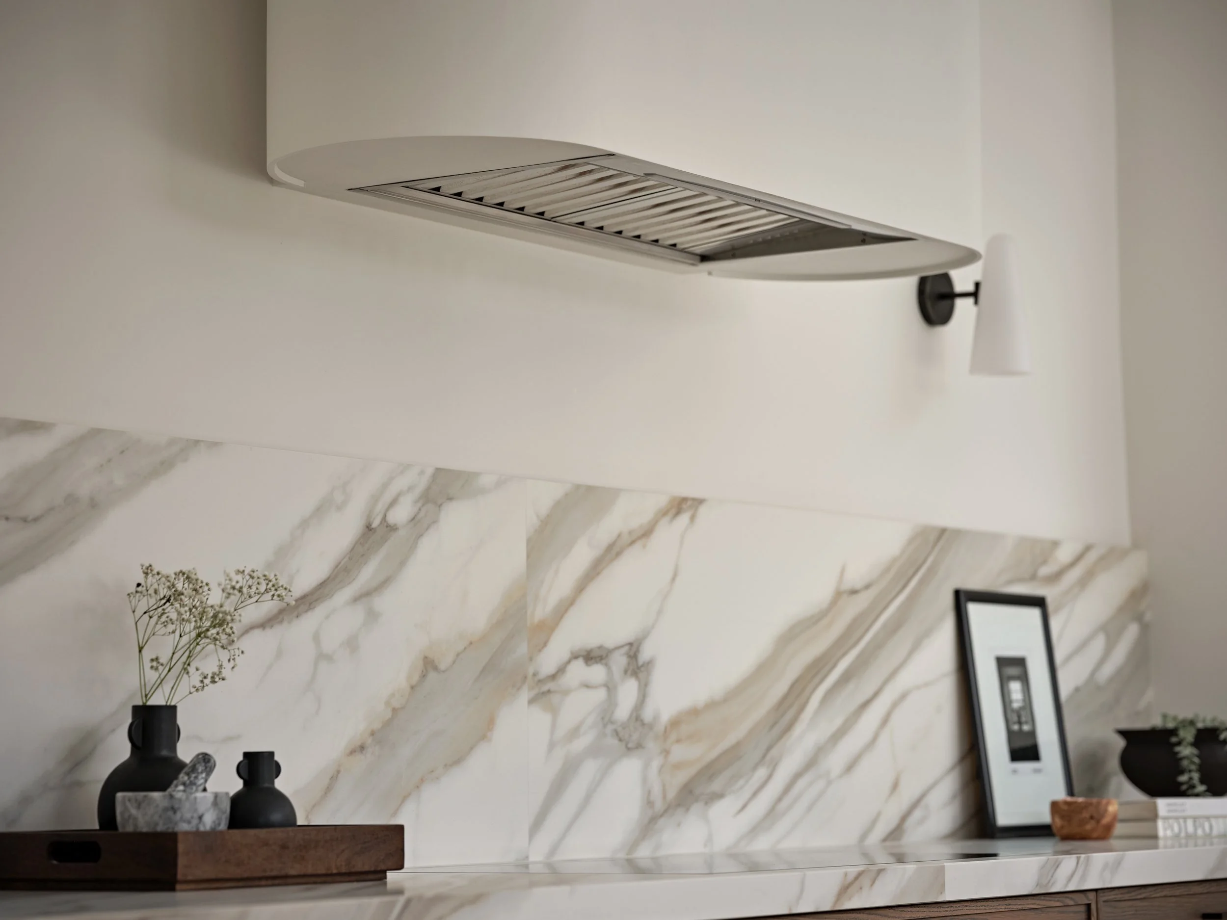 Westin Extractor, housing in bespoke curved chimney.