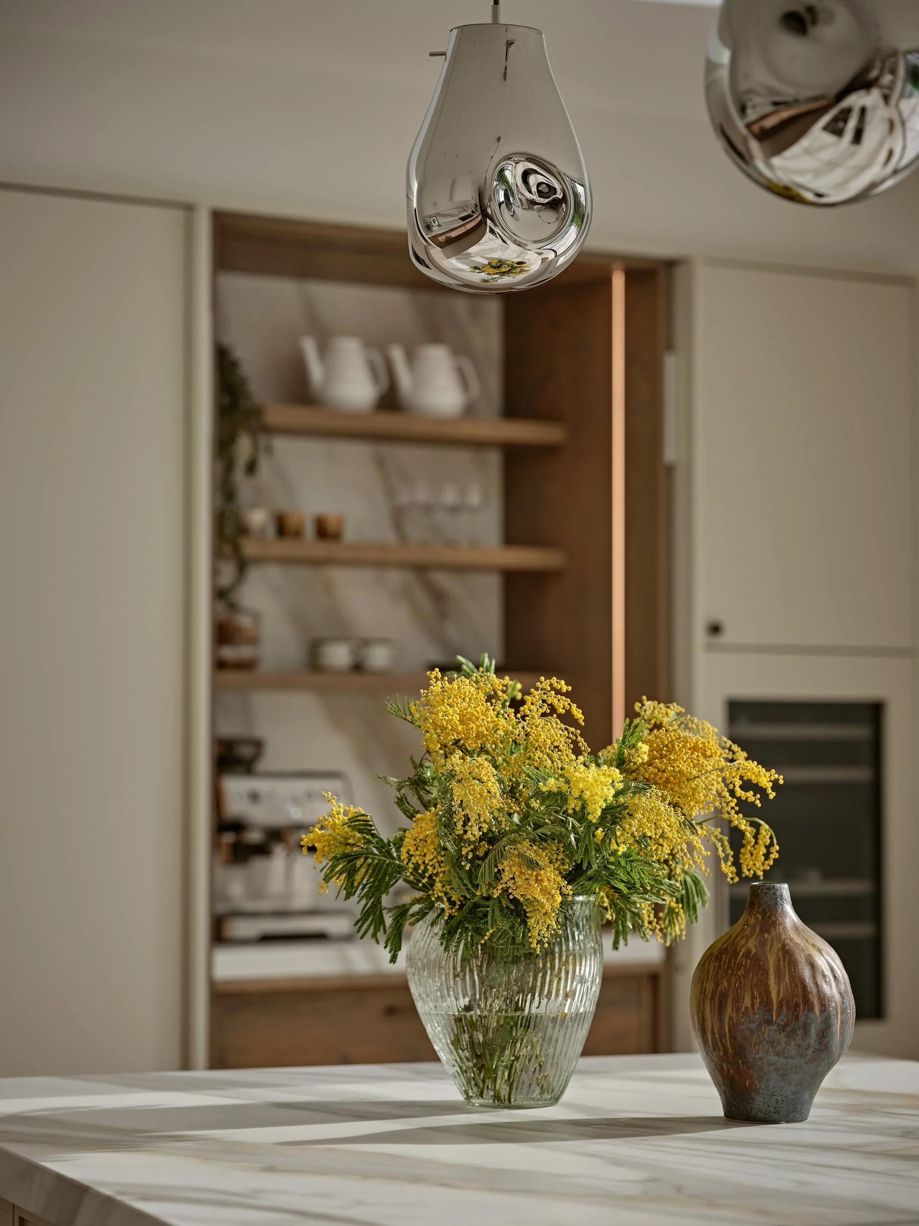 Pocket door coffee station/pantry. Warm oak veneer micro shaker fronts. Inner surface and splashback. 