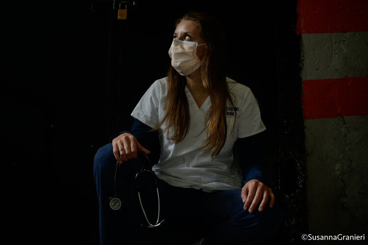 Valentino holds her stethoscope and looks into the sunlight, hoping for brighter days. Valentino graduates from her nursing program in the spring of 2021.