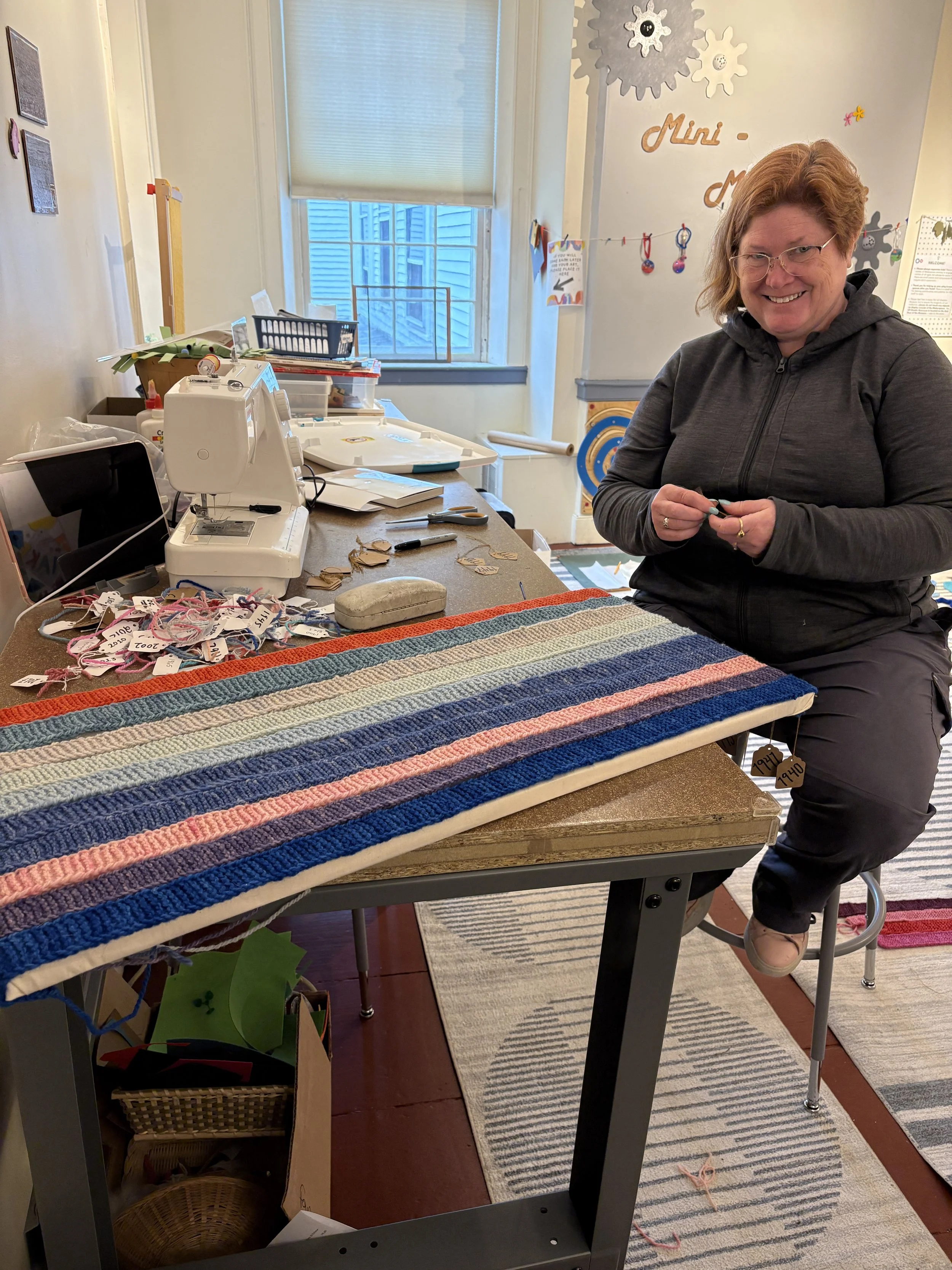Cindy Hill works on the labels for each year of the Tempestry! 