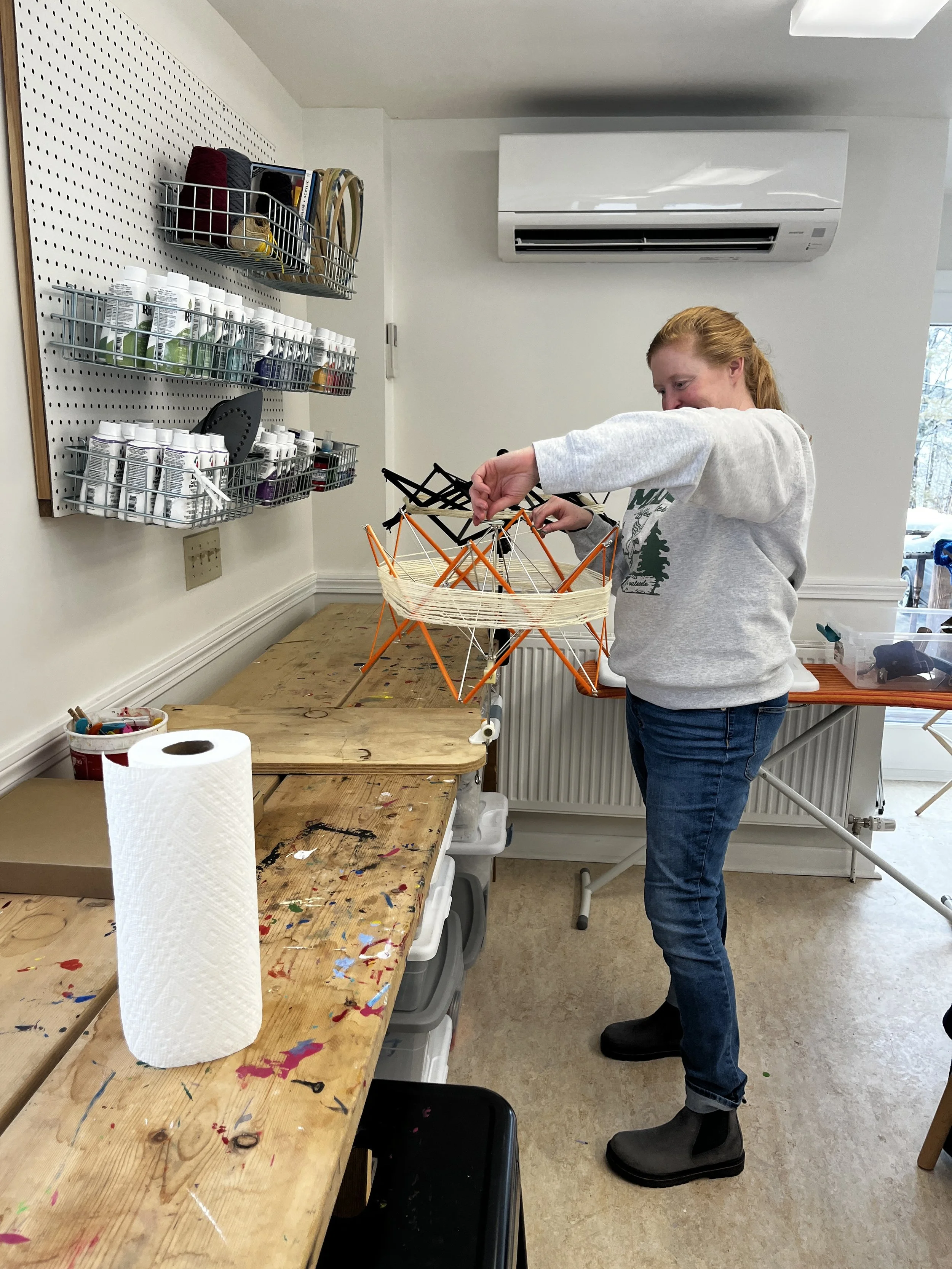 Ellery Foutch, HSM Trustee, winds skeins to be dyed at the Middlebury Studio School.
