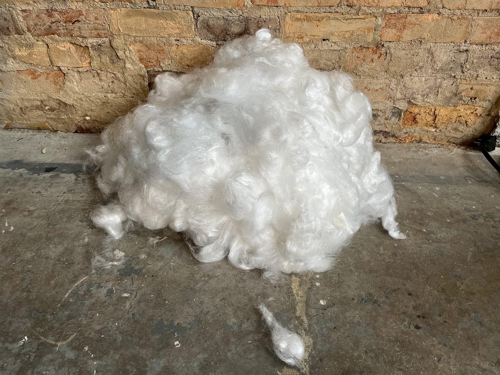 *76,800 minutes — gathered pile of sound cut fibers