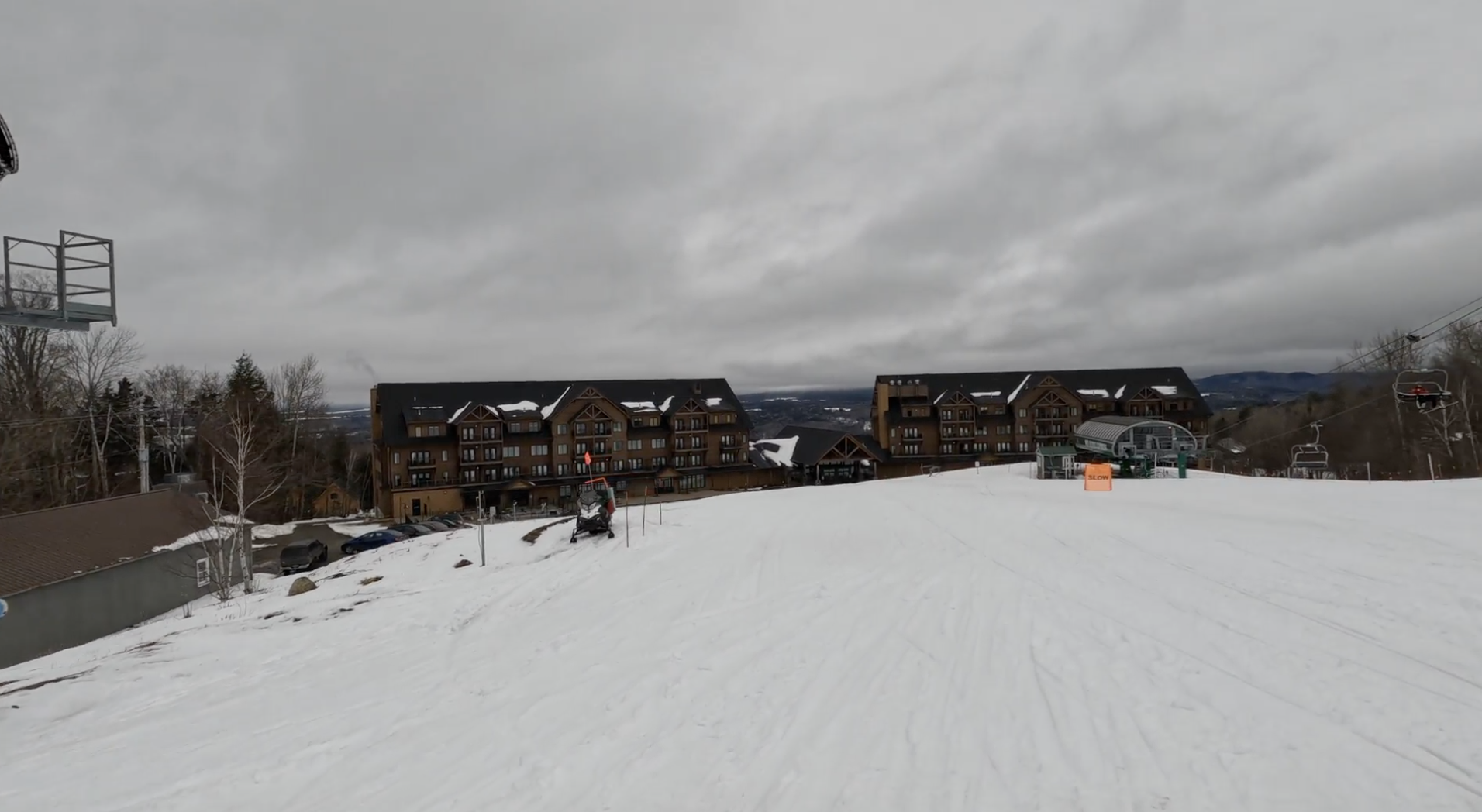 Slopeside hotels at Burke ski resort, Vermont, next to the bottom station of a chairlift
