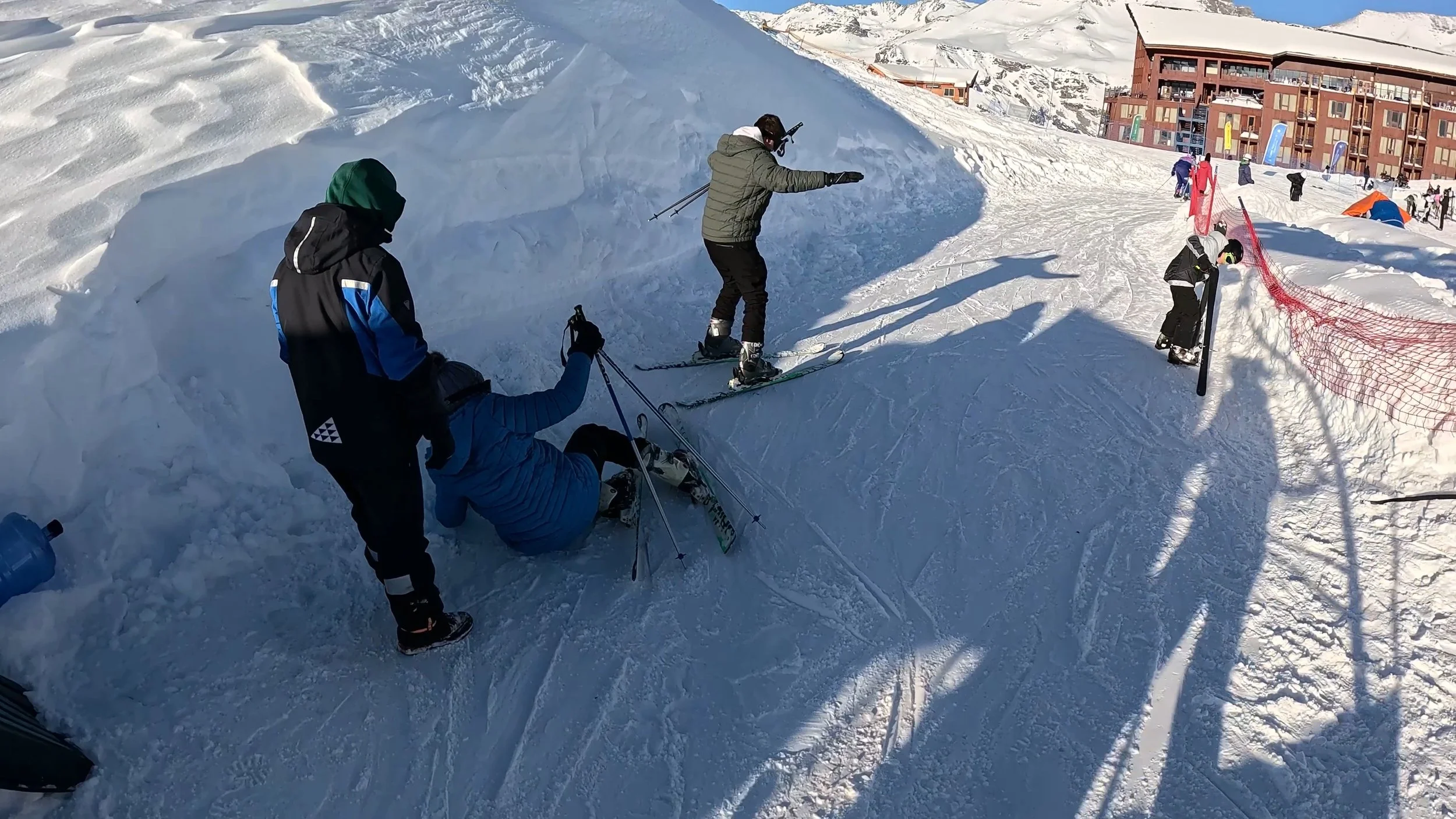 Beginner skiers on a busy slope.