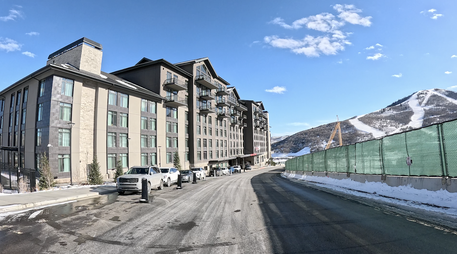 Walking toward the Grand Hyatt hotel at Deer Valley ski resort on a sunny day